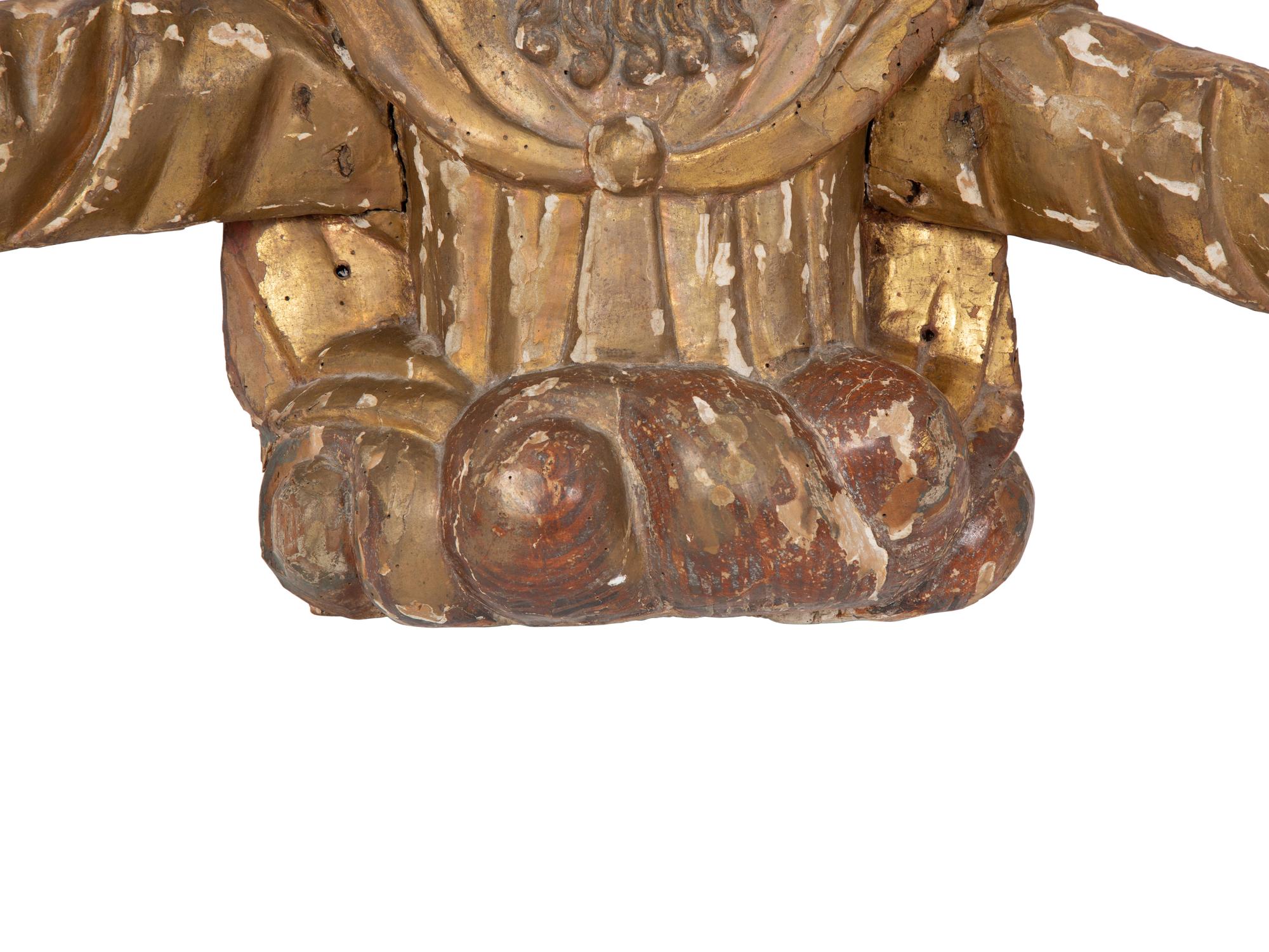 A Continental Painted and Parcel Gilt Carved Figure of a Saint with Outstretched Arms