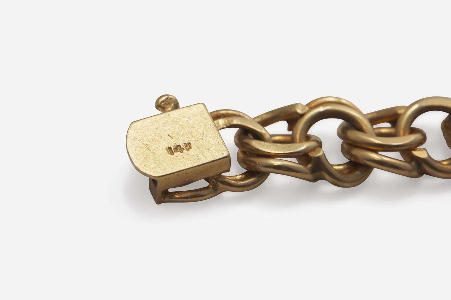 A Ladies 14K Yellow Gold Charm Bracelet