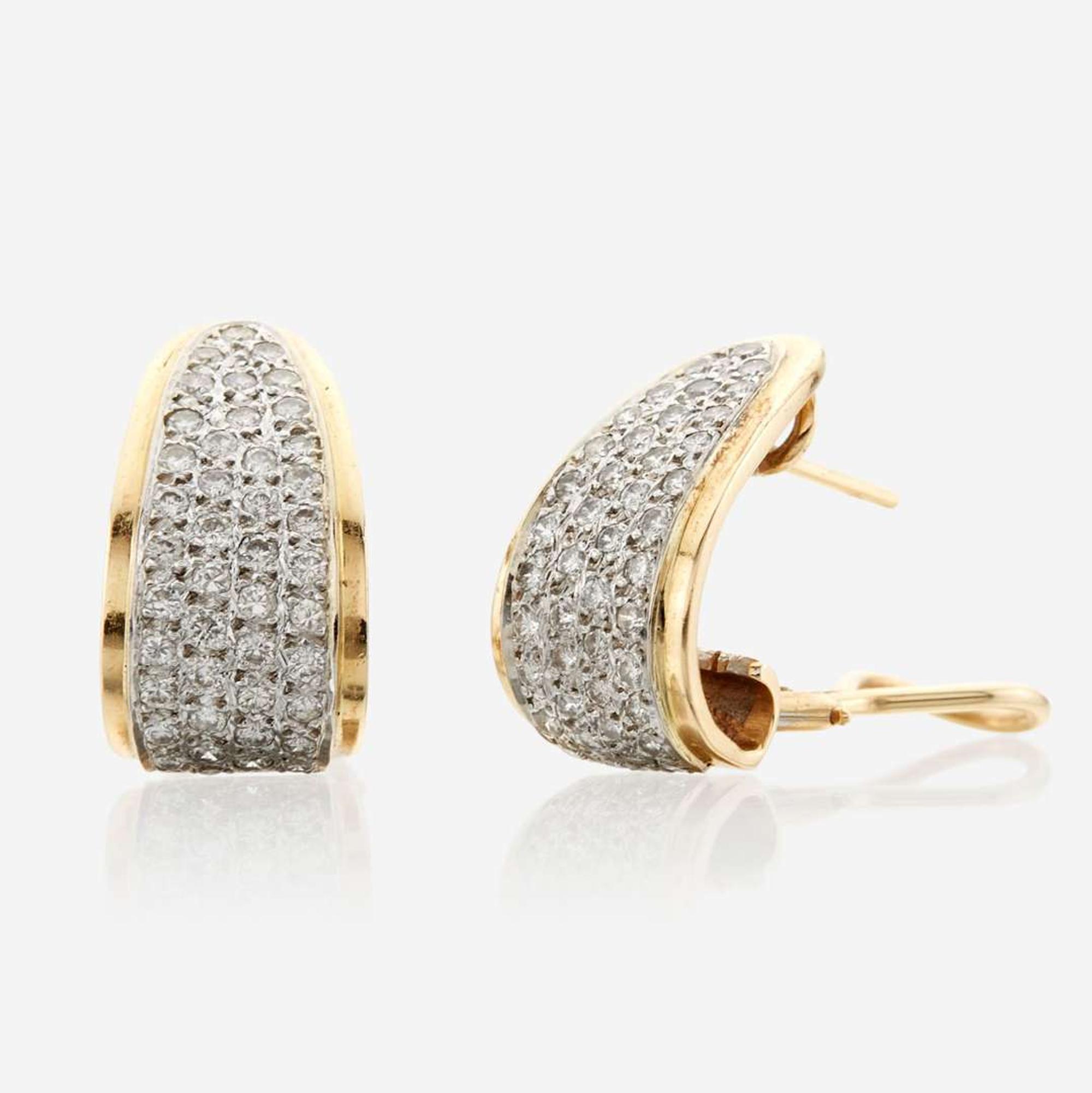 A pair of diamond and gold earrings