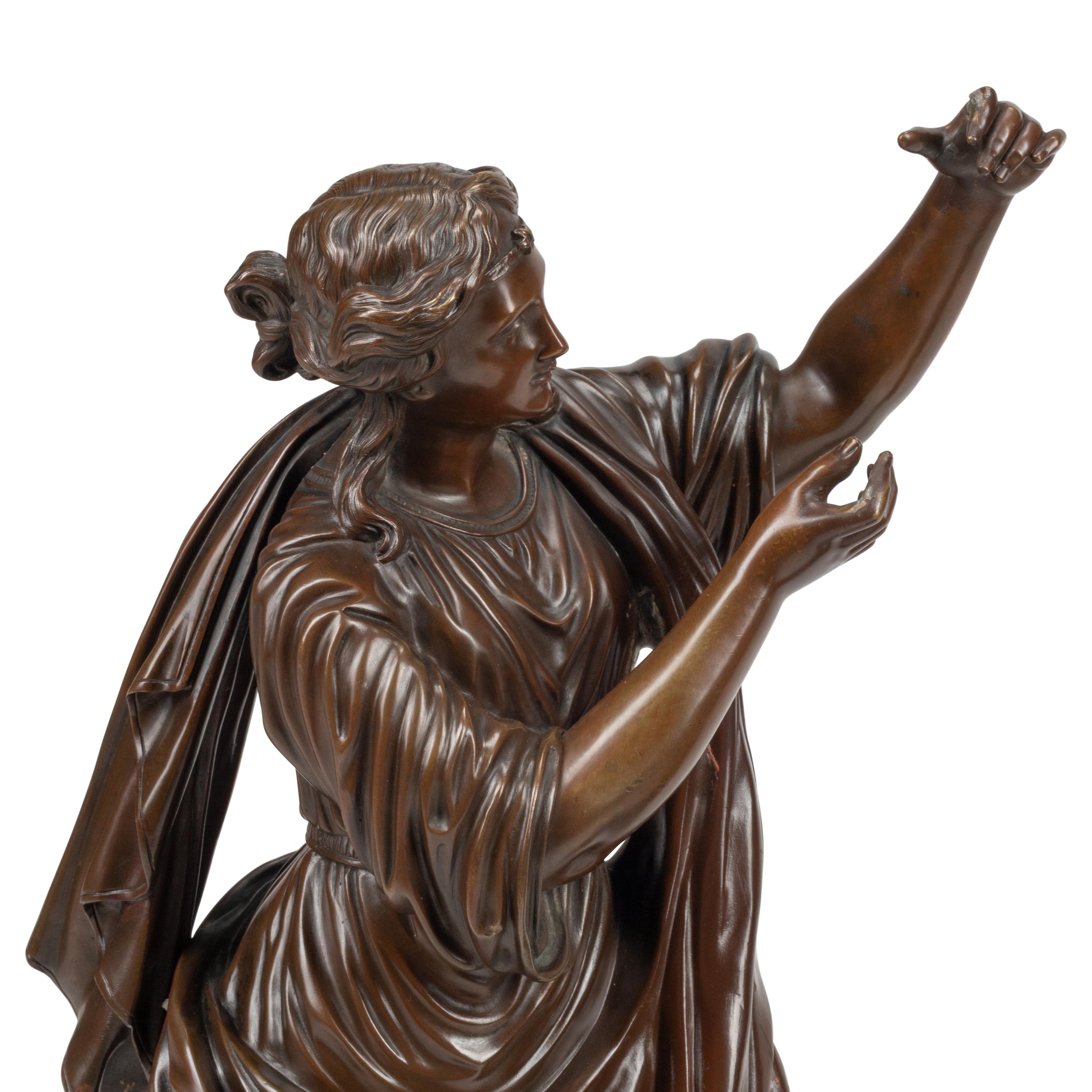 A Pair of French Patinated Bronze Figures