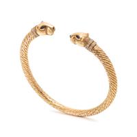 CARTIER, YELLOW GOLD, DIAMOND AND SAPPHIRE PANTHÈRE BANGLE BRACELET