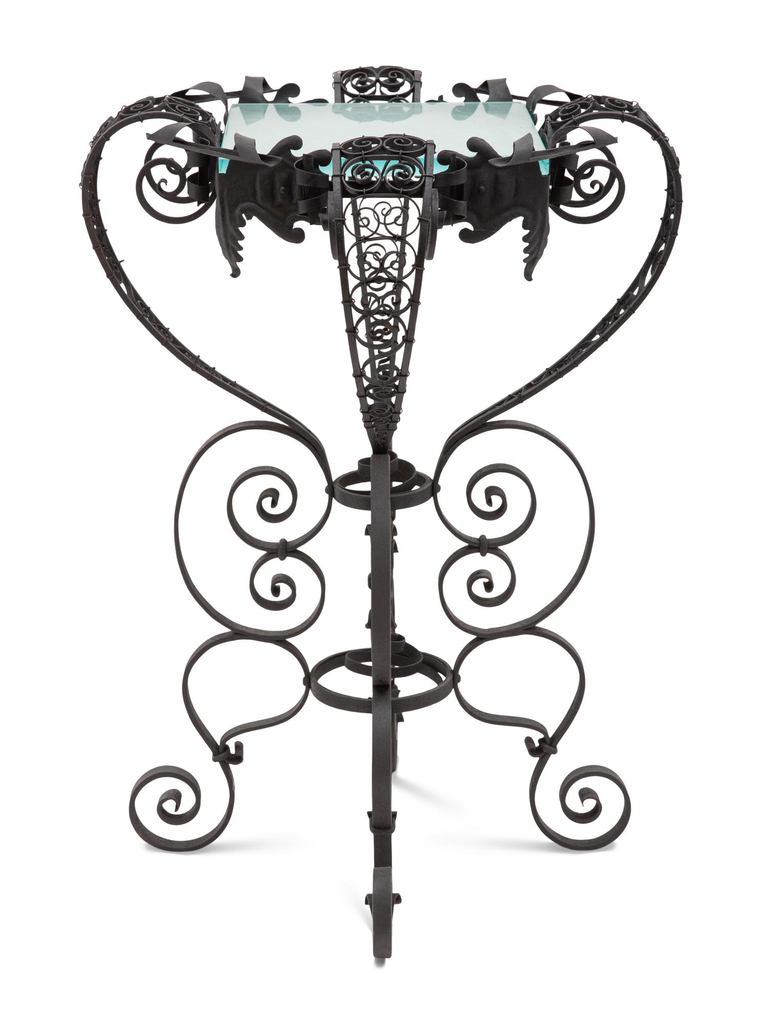 A Spanish Colonial Style Wrought Iron and Glass Stand