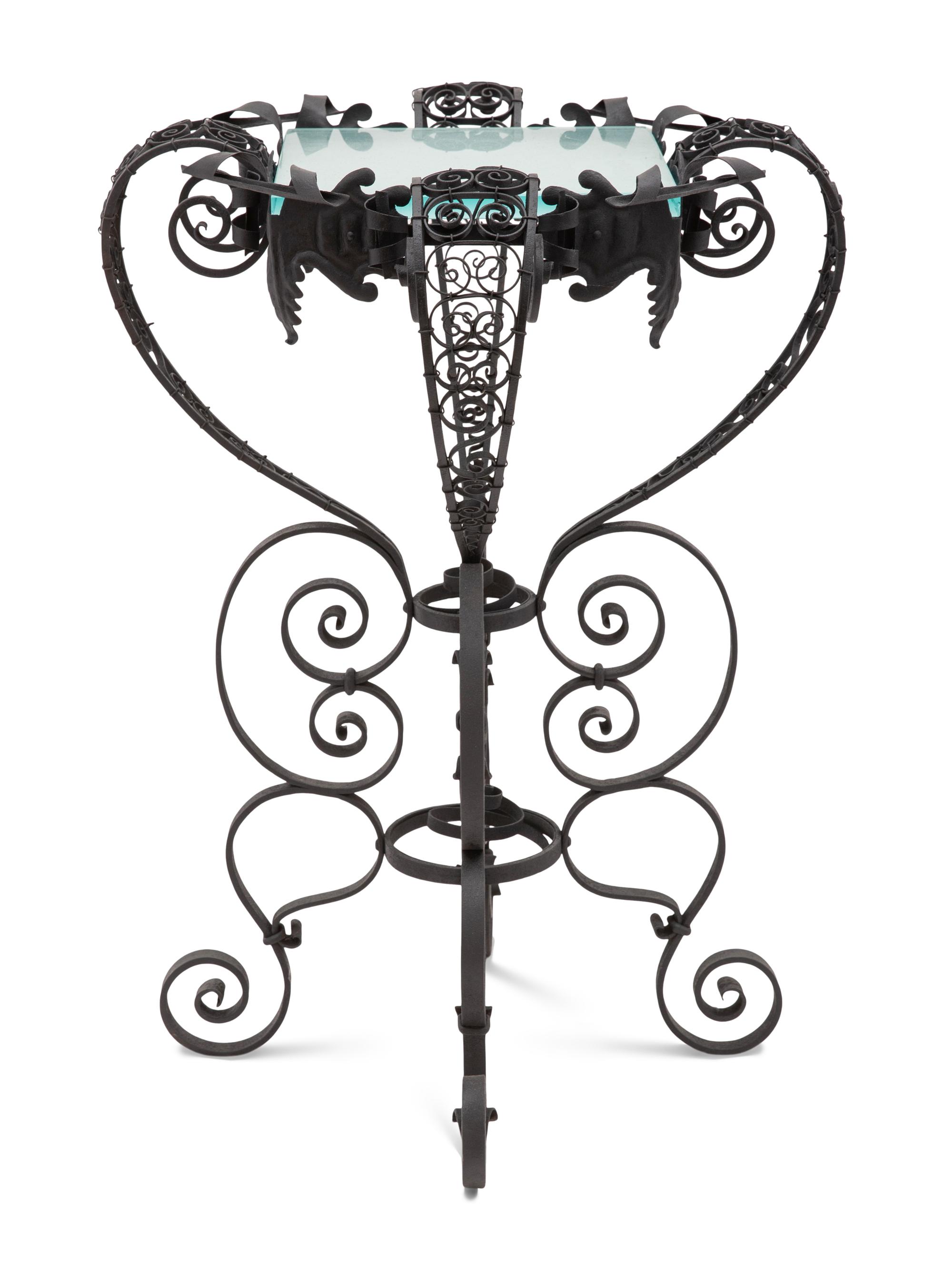 A Spanish Colonial Style Wrought Iron and Glass Stand