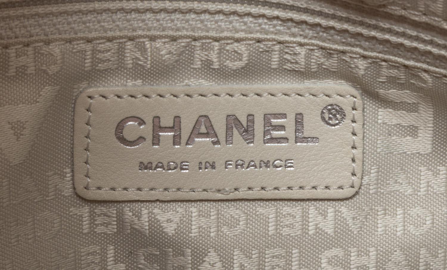 A Chanel Coral Calfskin Leather Quilted Fold Over Handbag, 12.5" x 11" x 4.5".