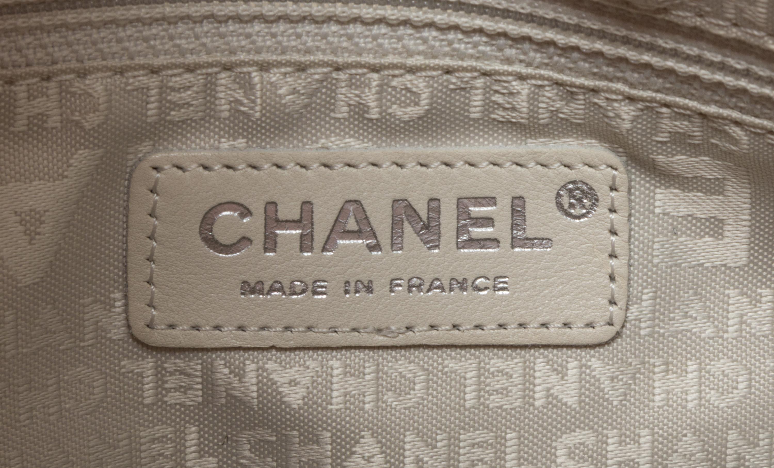 A Chanel Coral Calfskin Leather Quilted Fold Over Handbag, 12.5" x 11" x 4.5".