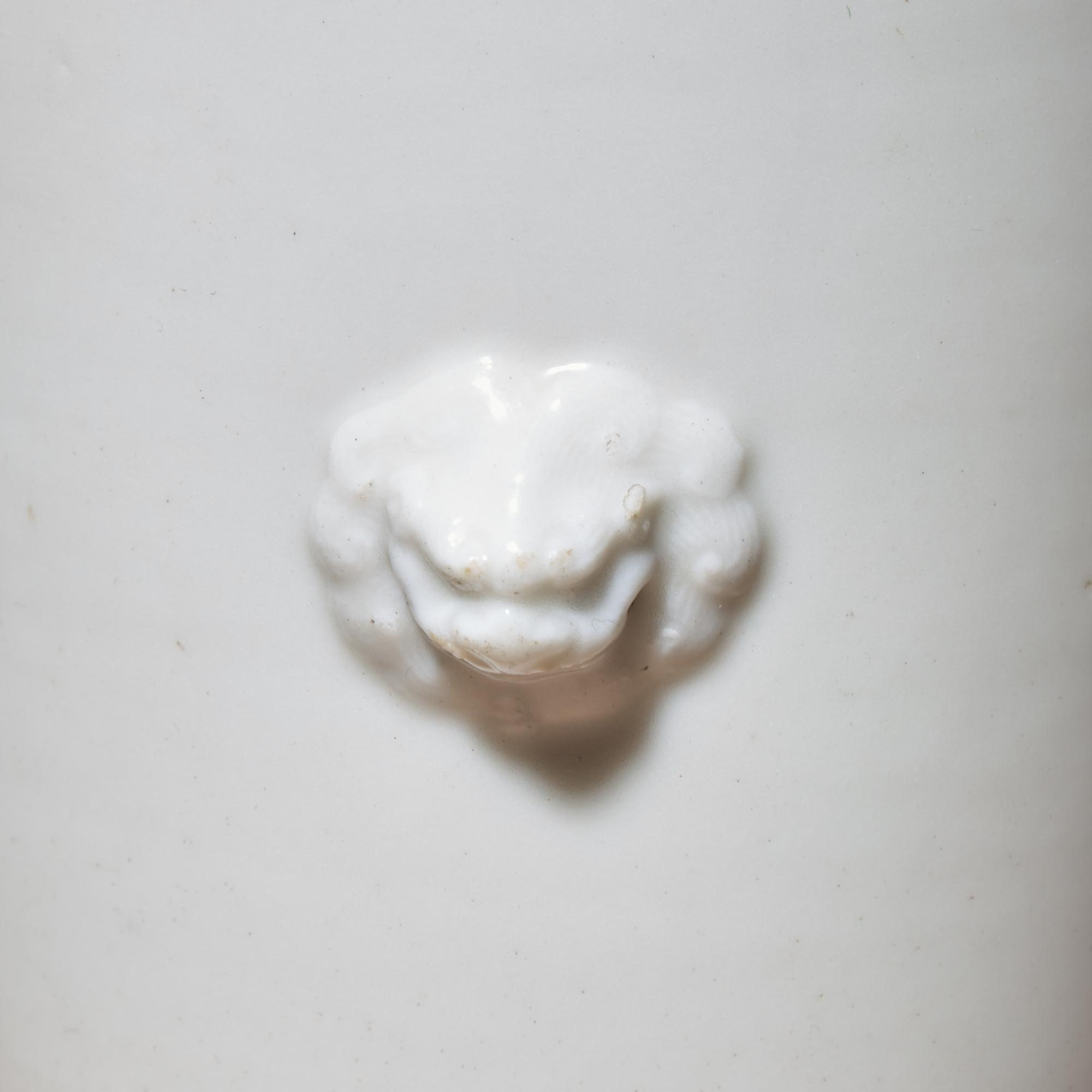 A Chinese Blanc-de-Chine Porcelain Sleeve Vase, Early Qing Dynasty — 清早期 德化白瓷雙獸首筒瓶