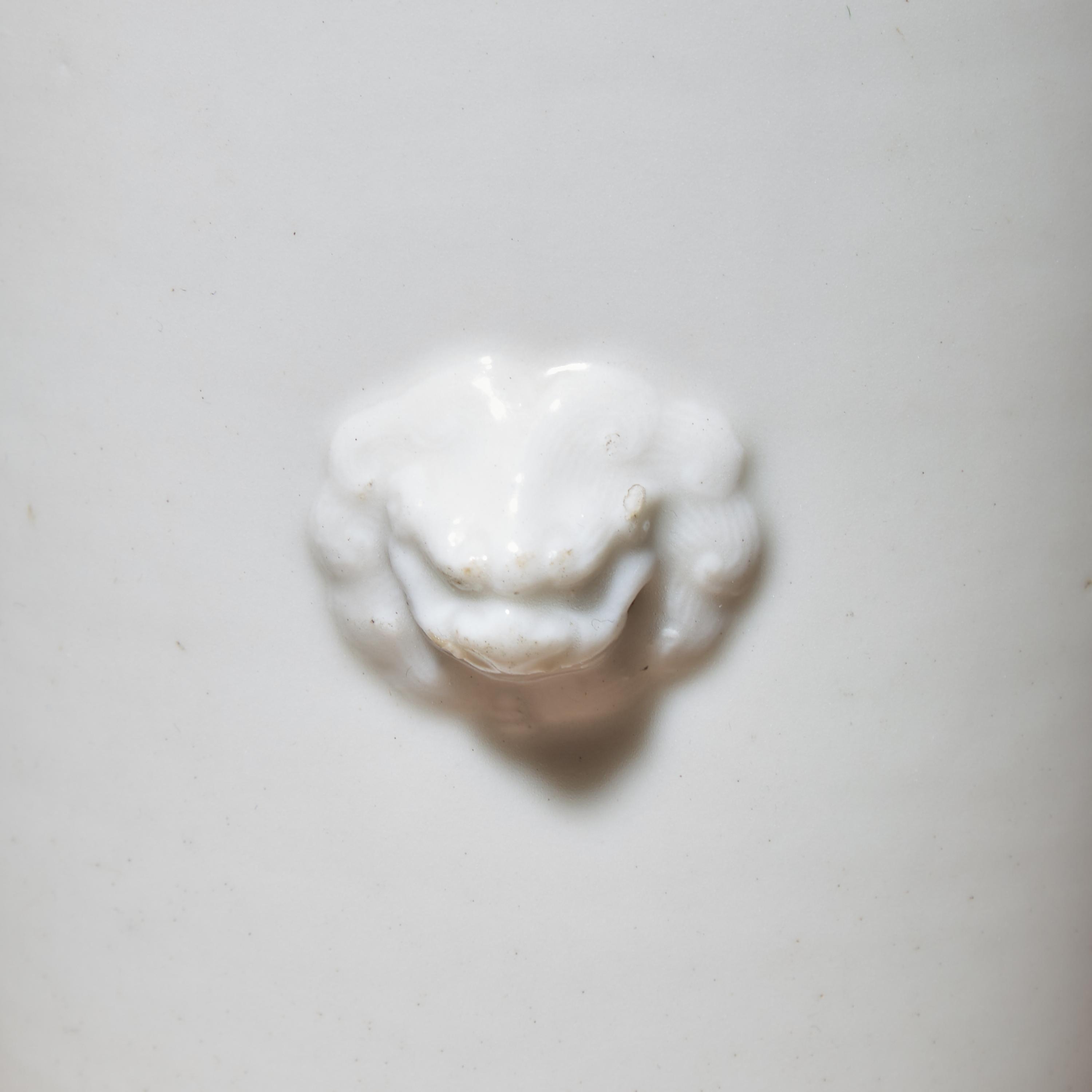 A Chinese Blanc-de-Chine Porcelain Sleeve Vase, Early Qing Dynasty — 清早期 德化白瓷雙獸首筒瓶