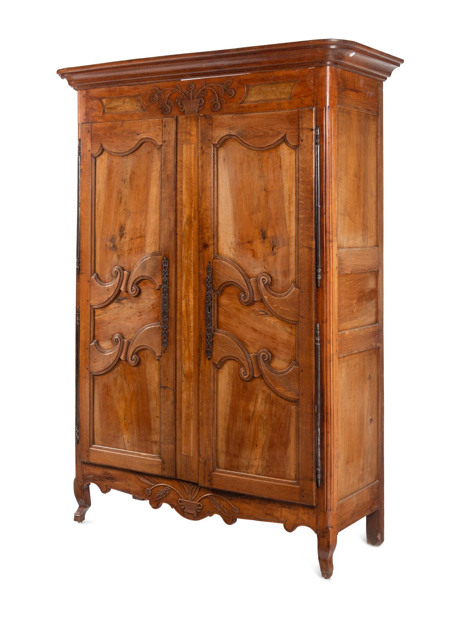 A French Provincial Walnut and Fruitwood Armoire