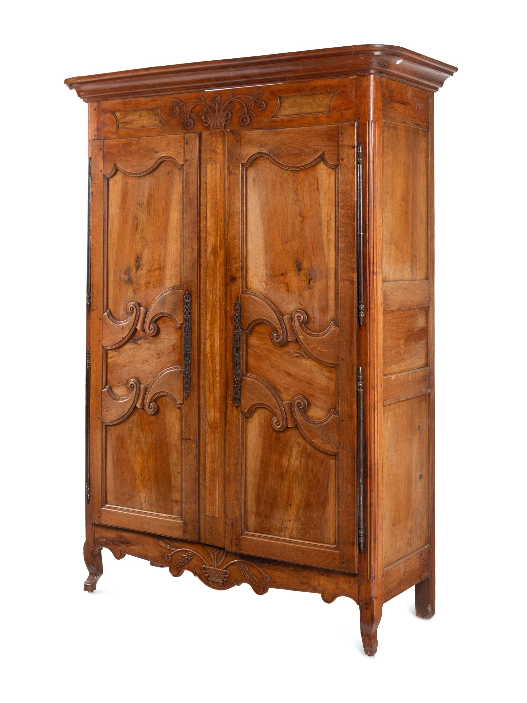A French Provincial Walnut and Fruitwood Armoire