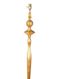 A Gilt Lead Floor Lamp — CIRCA 1930