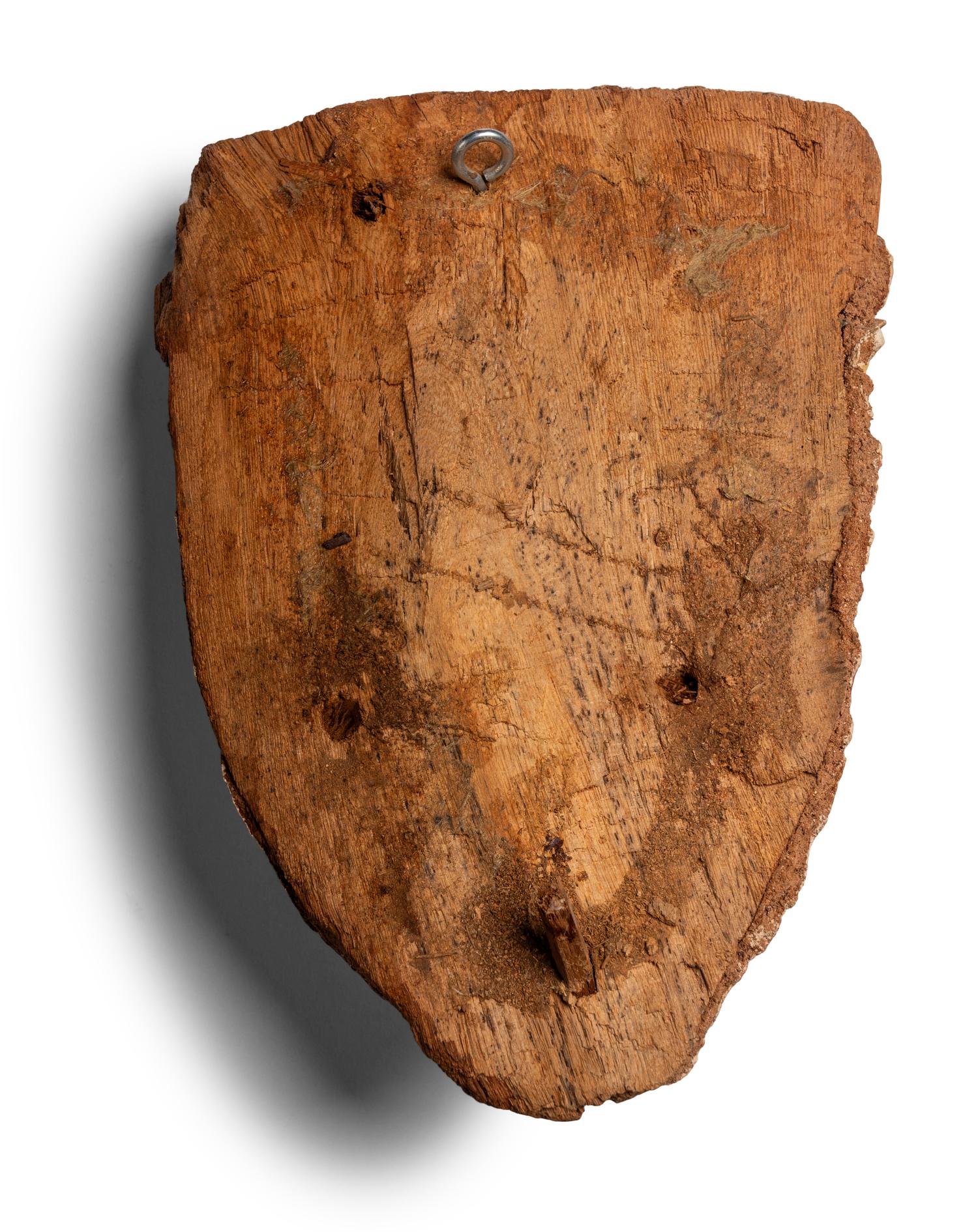 An Egyptian Wood and Painted Cartonnage Mummy Mask