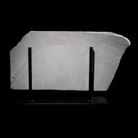 An Egyptian Polychrome Limestone Relief Fragment