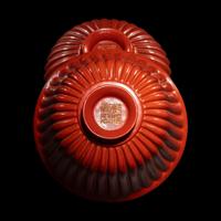 A Fine Red Lacquer Inscribed 'Chrysanthemum' Tea Bowl and Cover, Qianlong Mark 乾隆年製款 朱漆御題詩菊瓣式蓋碗