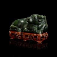 A Chinese Spinach Jade Buffalo, Qing Dynasty 清 青玉臥牛