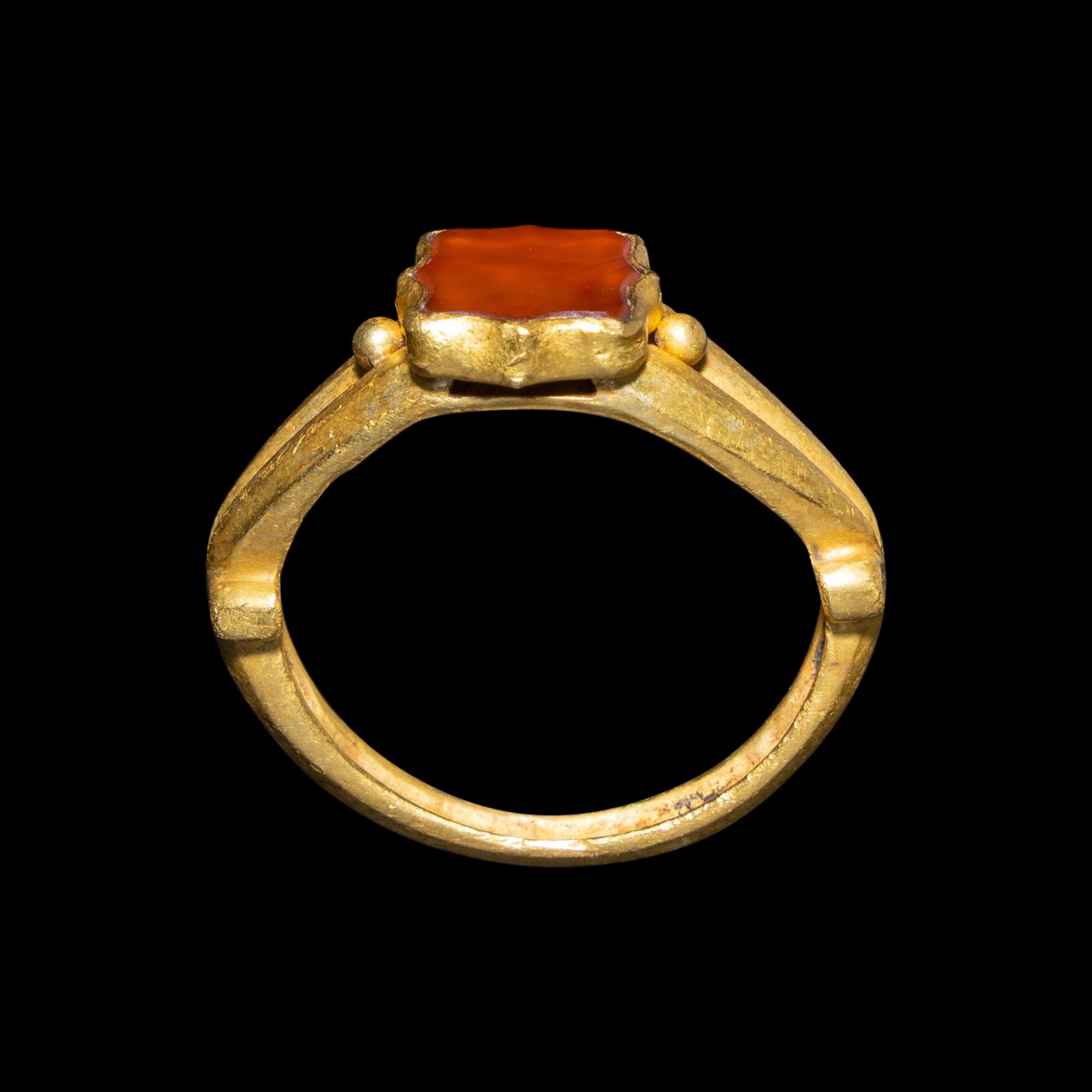 A Migration Period Gold and Spessartine Garnet Ring