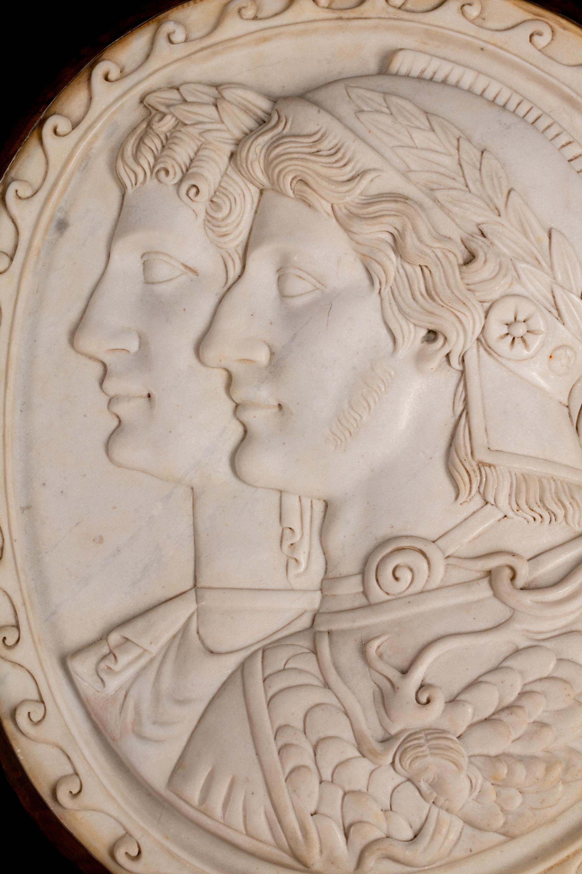 A Pair of Italian Neoclassical Style Iron-Mounted Marble Portrait Reliefs of a Caesar
