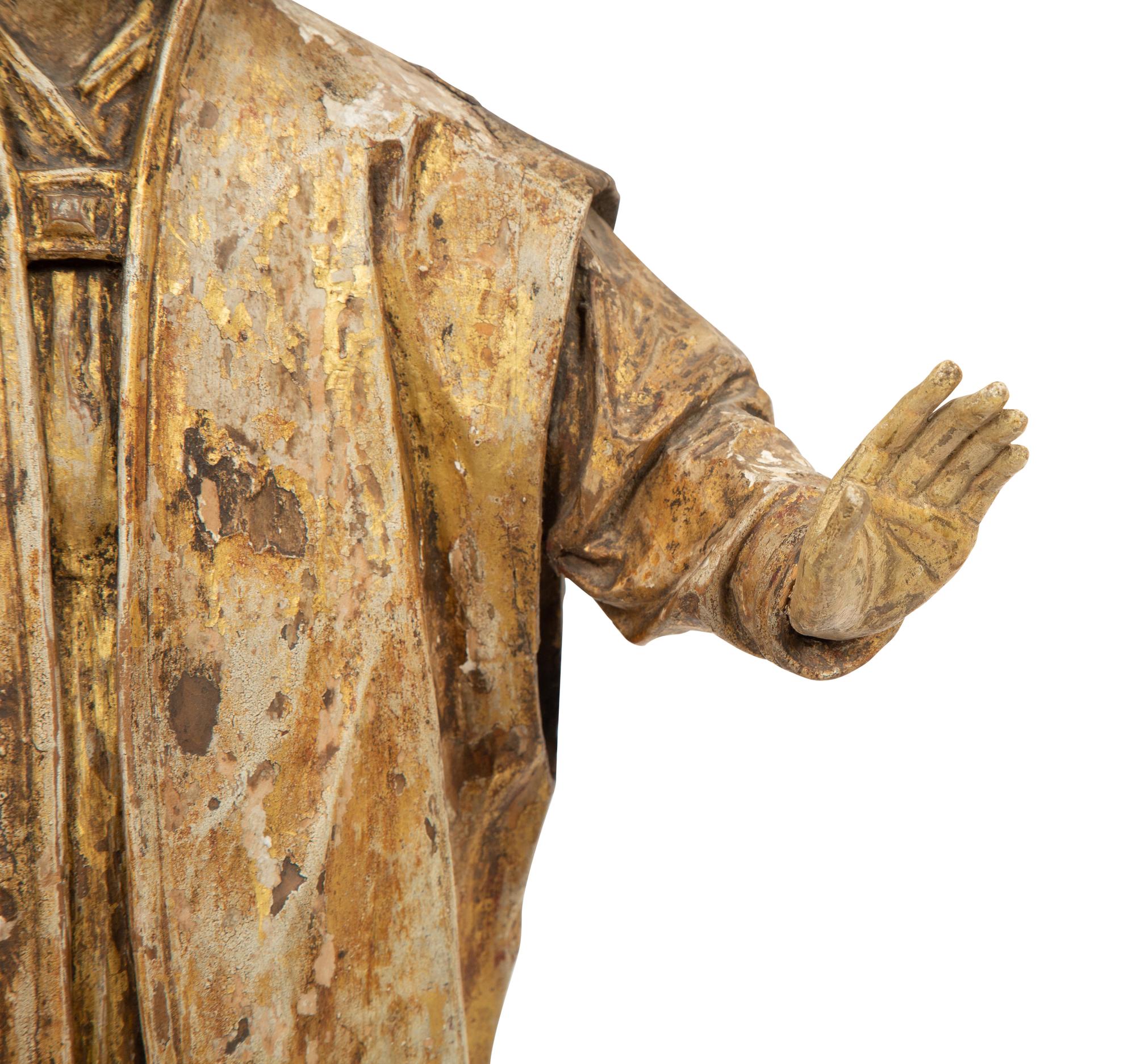 A Continental Carved Polychrome and Gilt Wood Figure