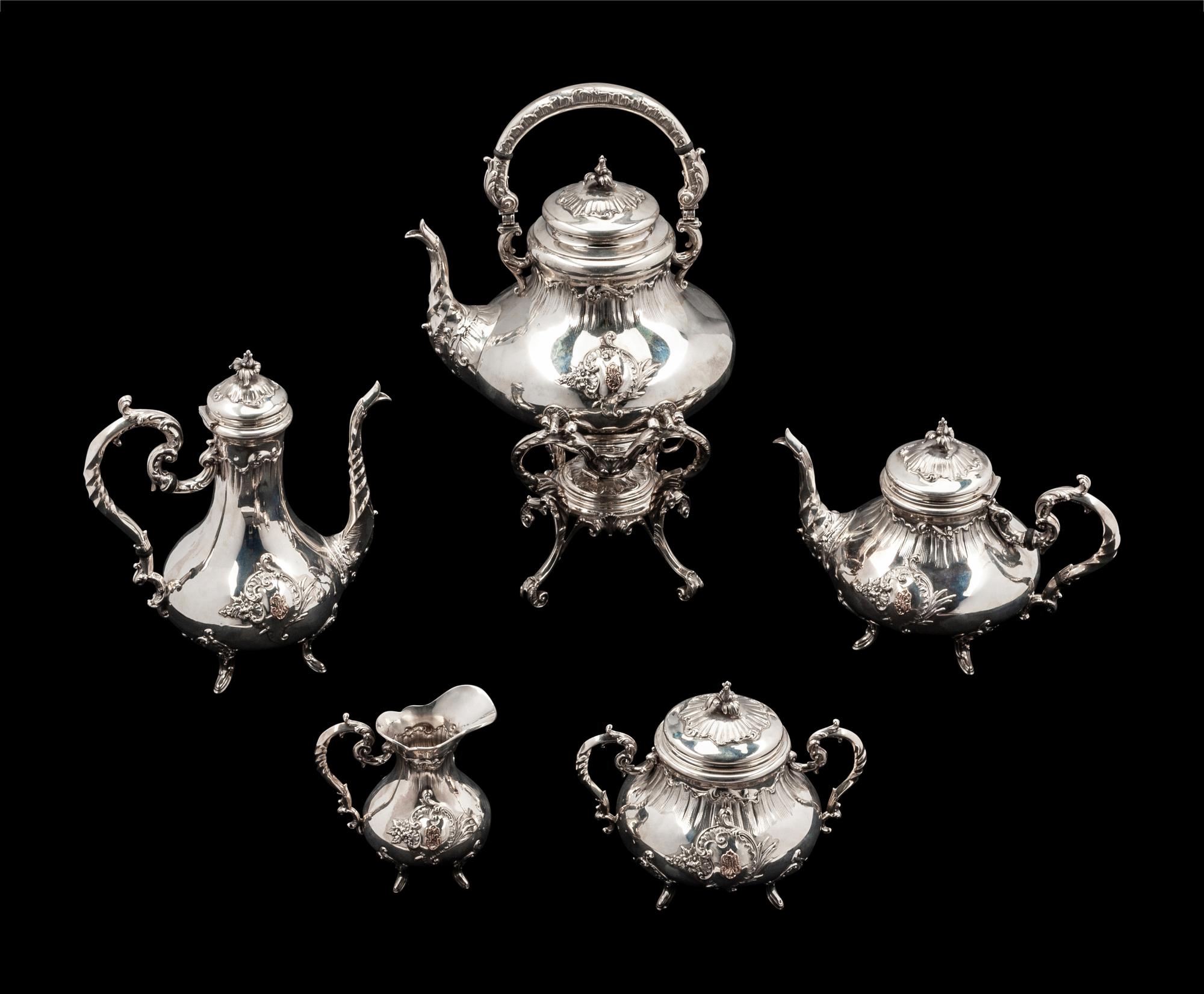 A French Silver and 18-Karat Gold Five-Piece Tea and Coffee Service