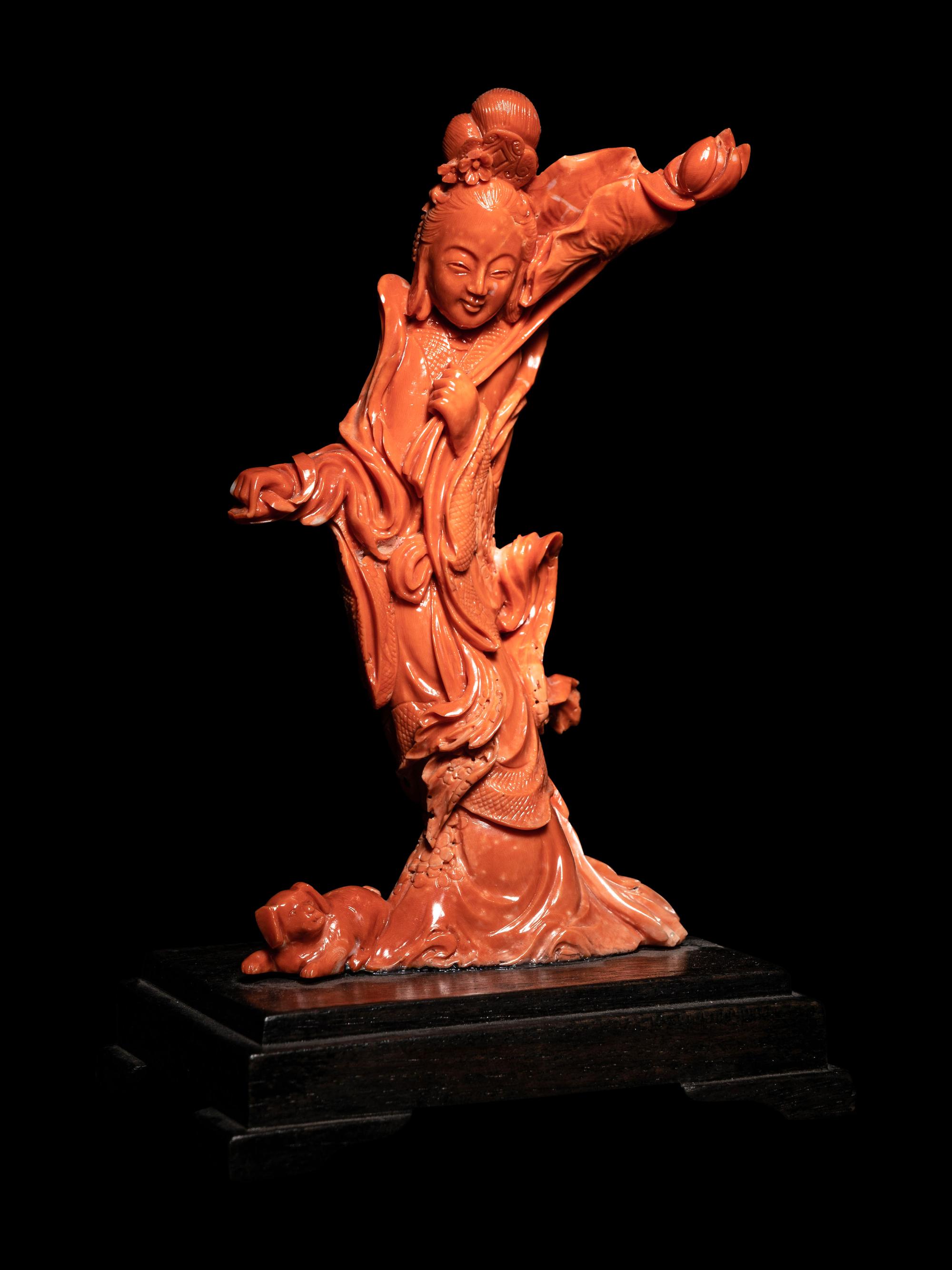 A Chinese Carved Red Coral Figure of a Female Immortal