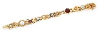 A Vintage 14 Karat Yellow Gold, Enamel and Multi Gem Charm Slide Bracelet, 24.50 dwts.