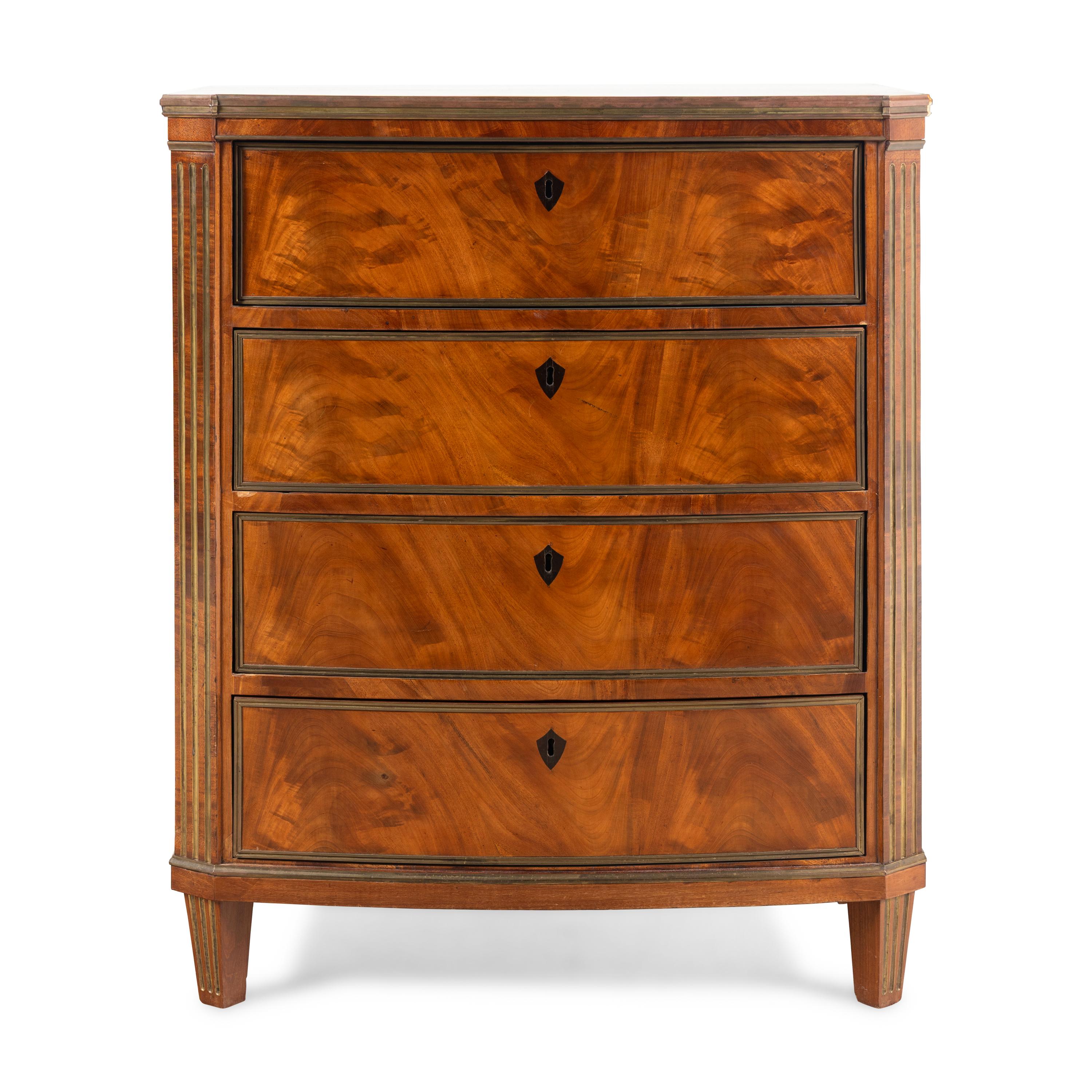 A Russian or Baltic Neoclassical Brass Mounted Mahogany Chest of Drawers