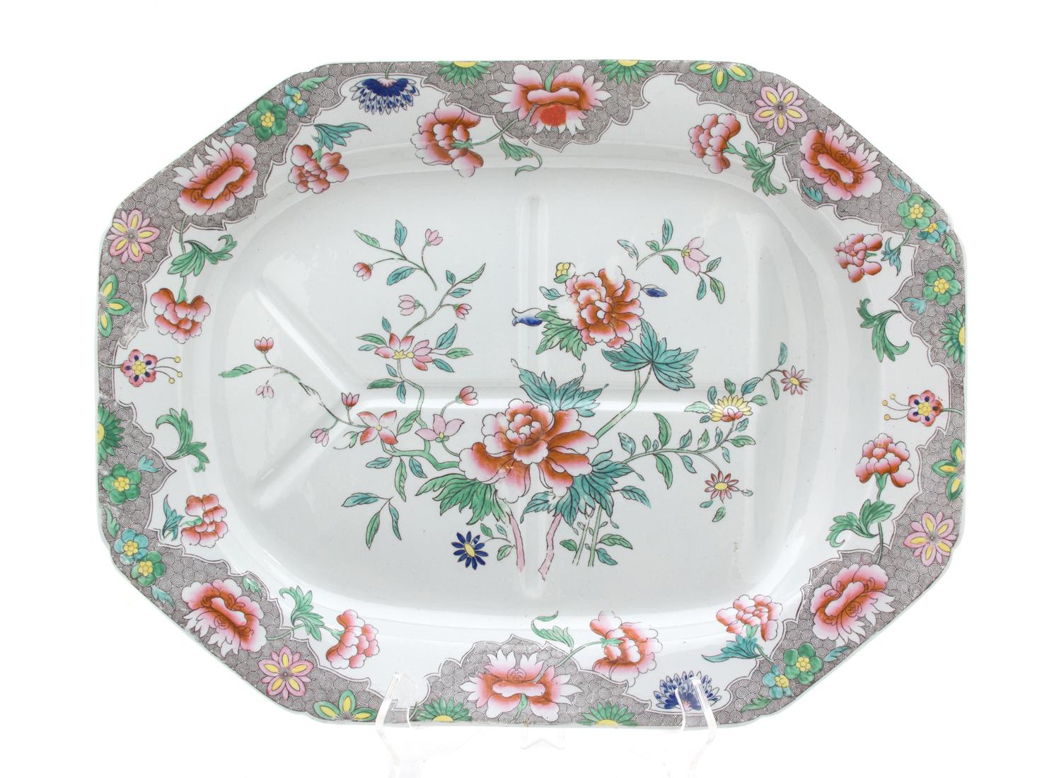 An English Polychromed Decorated Stoneware Well-and-Tree Platter Length 20 inches. — 20TH CENTURY