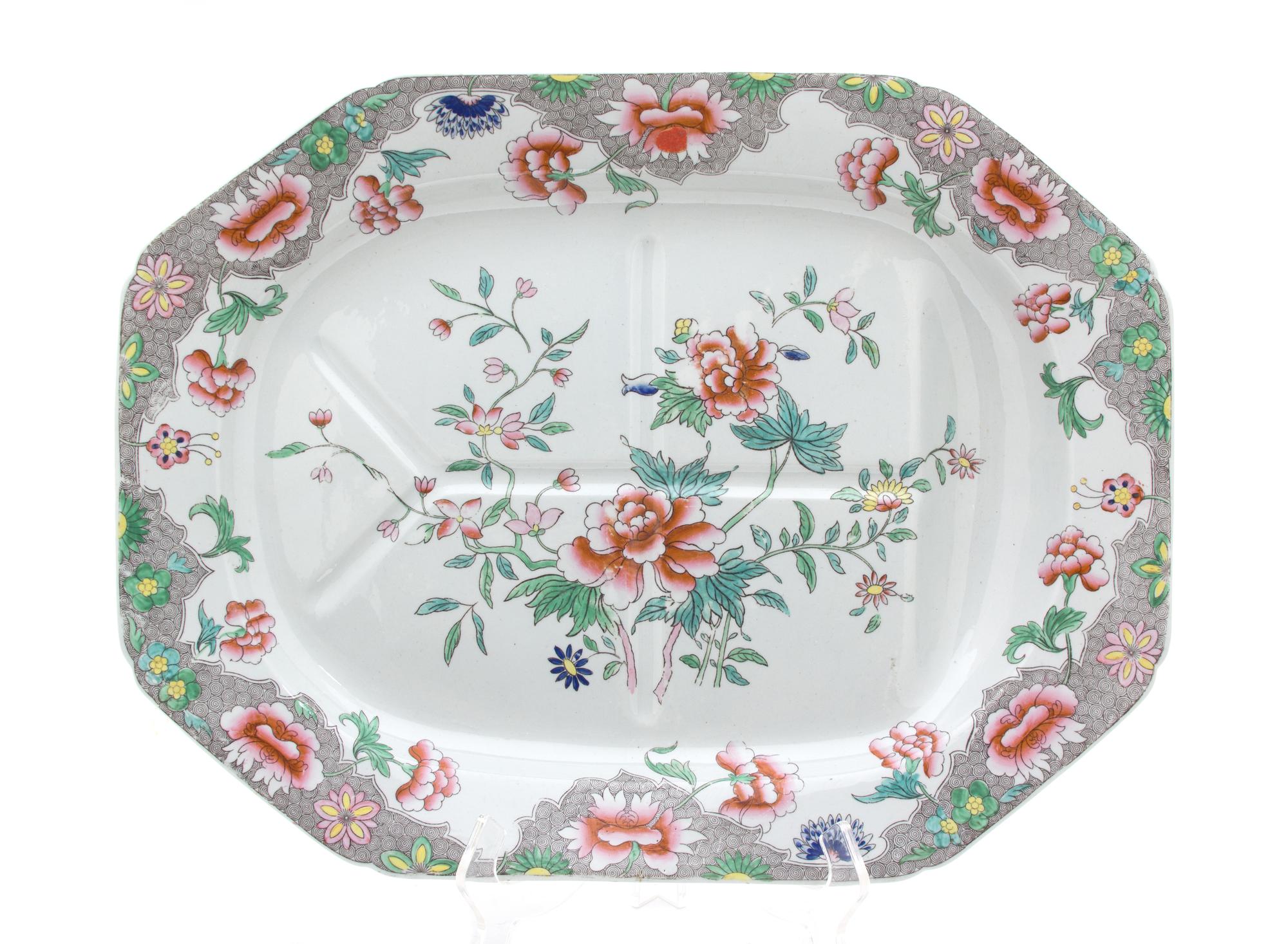 An English Polychromed Decorated Stoneware Well-and-Tree Platter Length 20 inches. — 20TH CENTURY