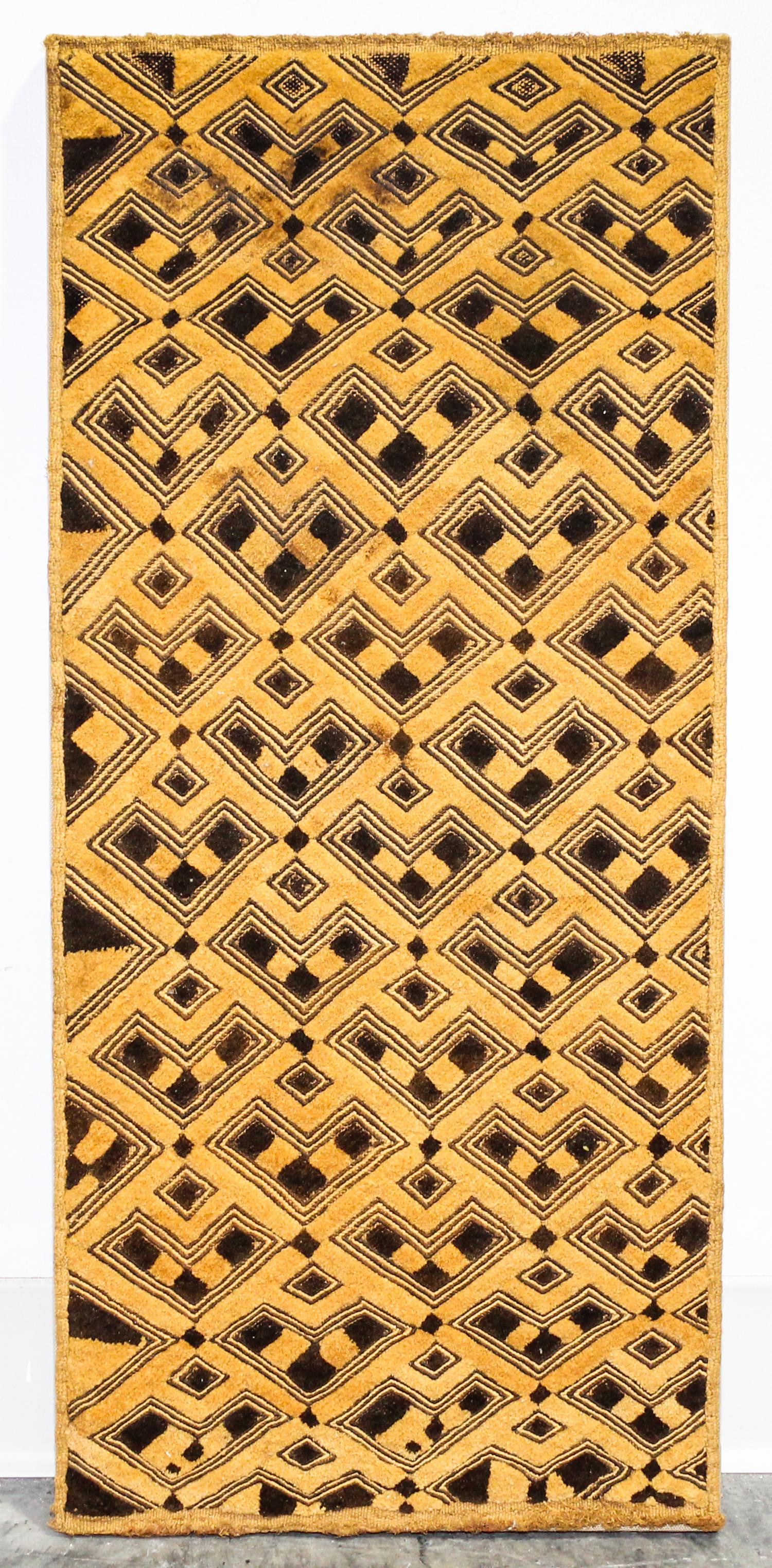 A Kuba Cloth Length 29 x width 12 3/4 inches.