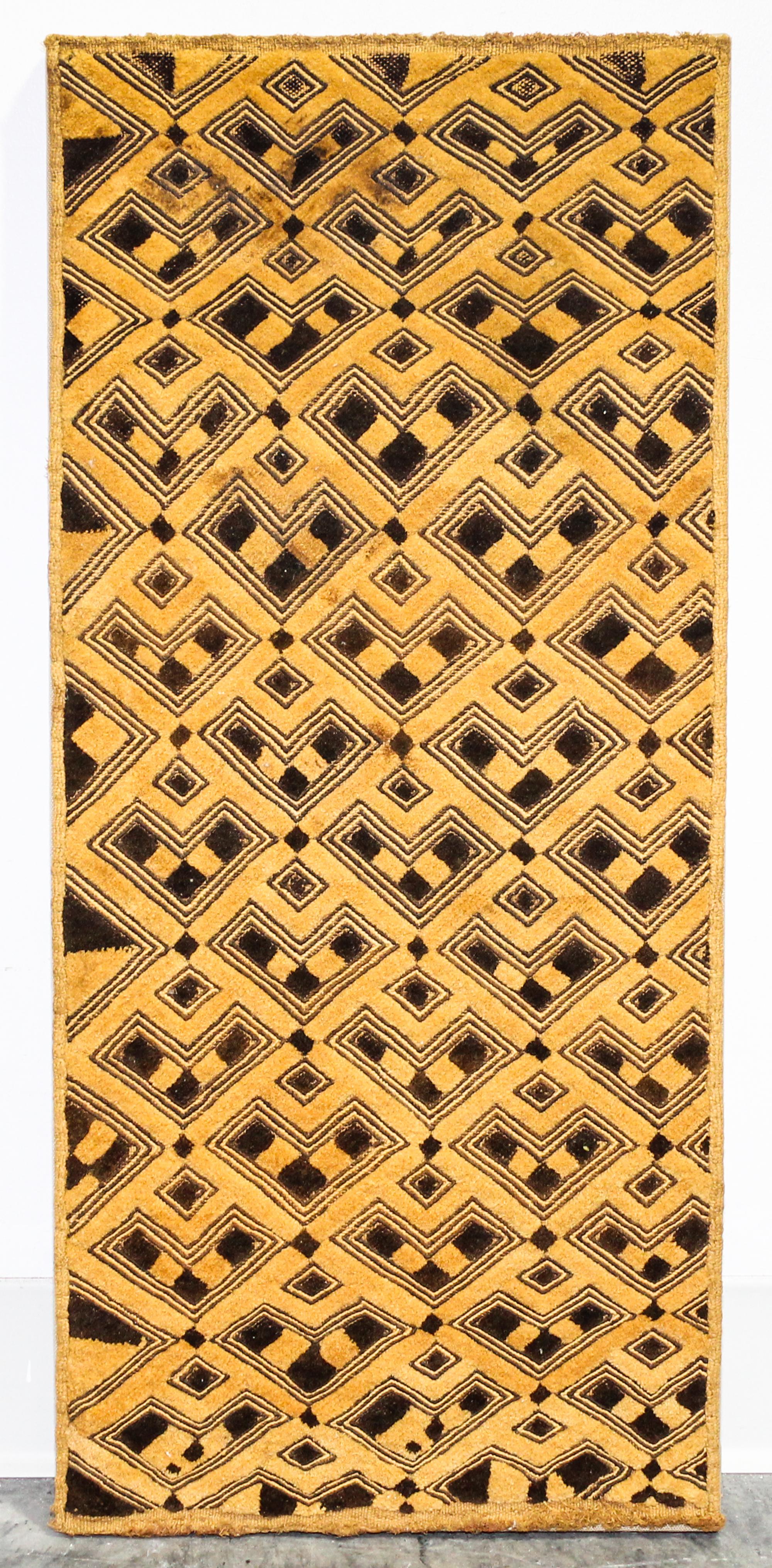 A Kuba Cloth Length 29 x width 12 3/4 inches.