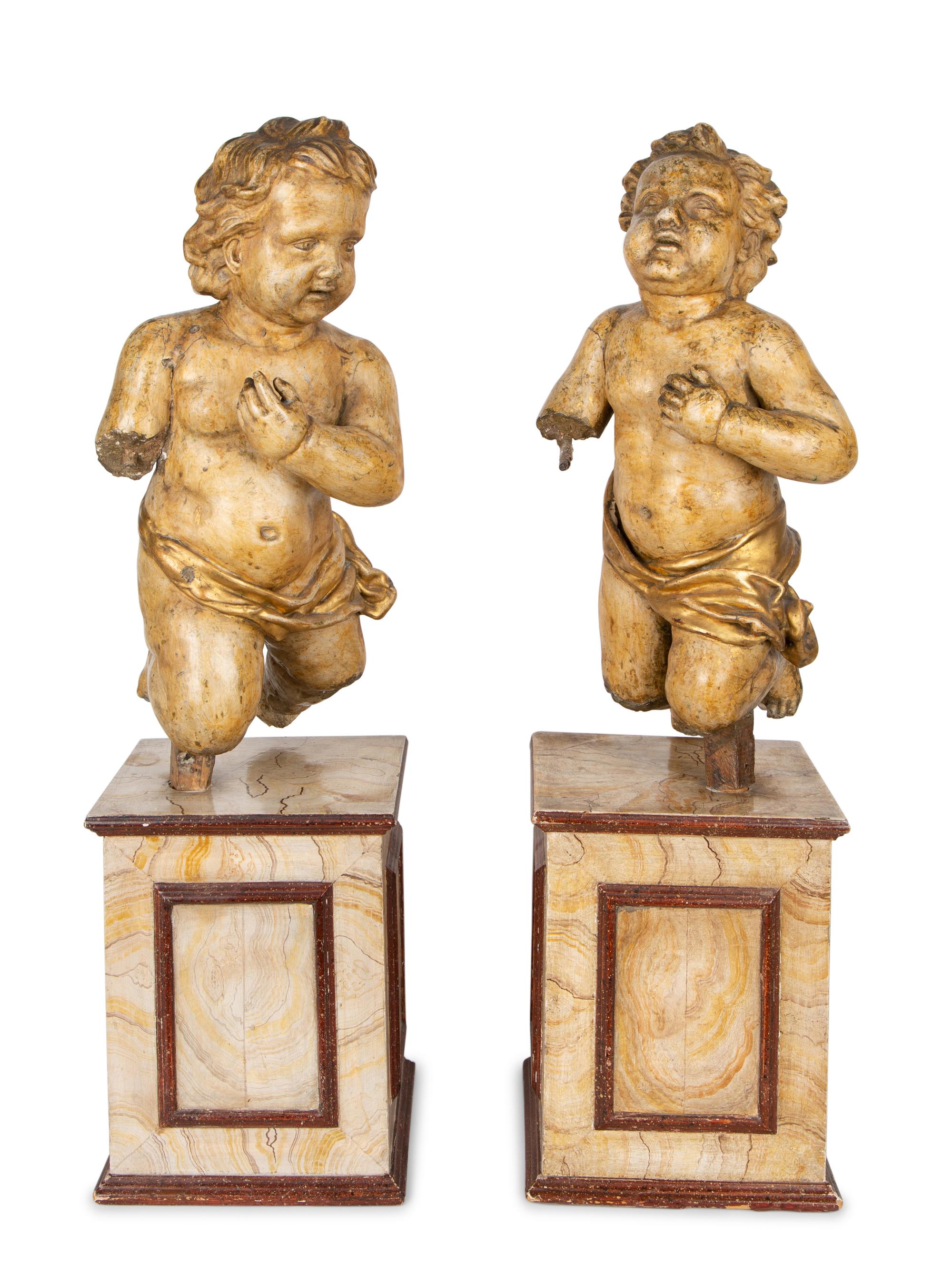 A Pair of Italian Carved and Parcel Gilt Cherubs — 19TH CENTURY