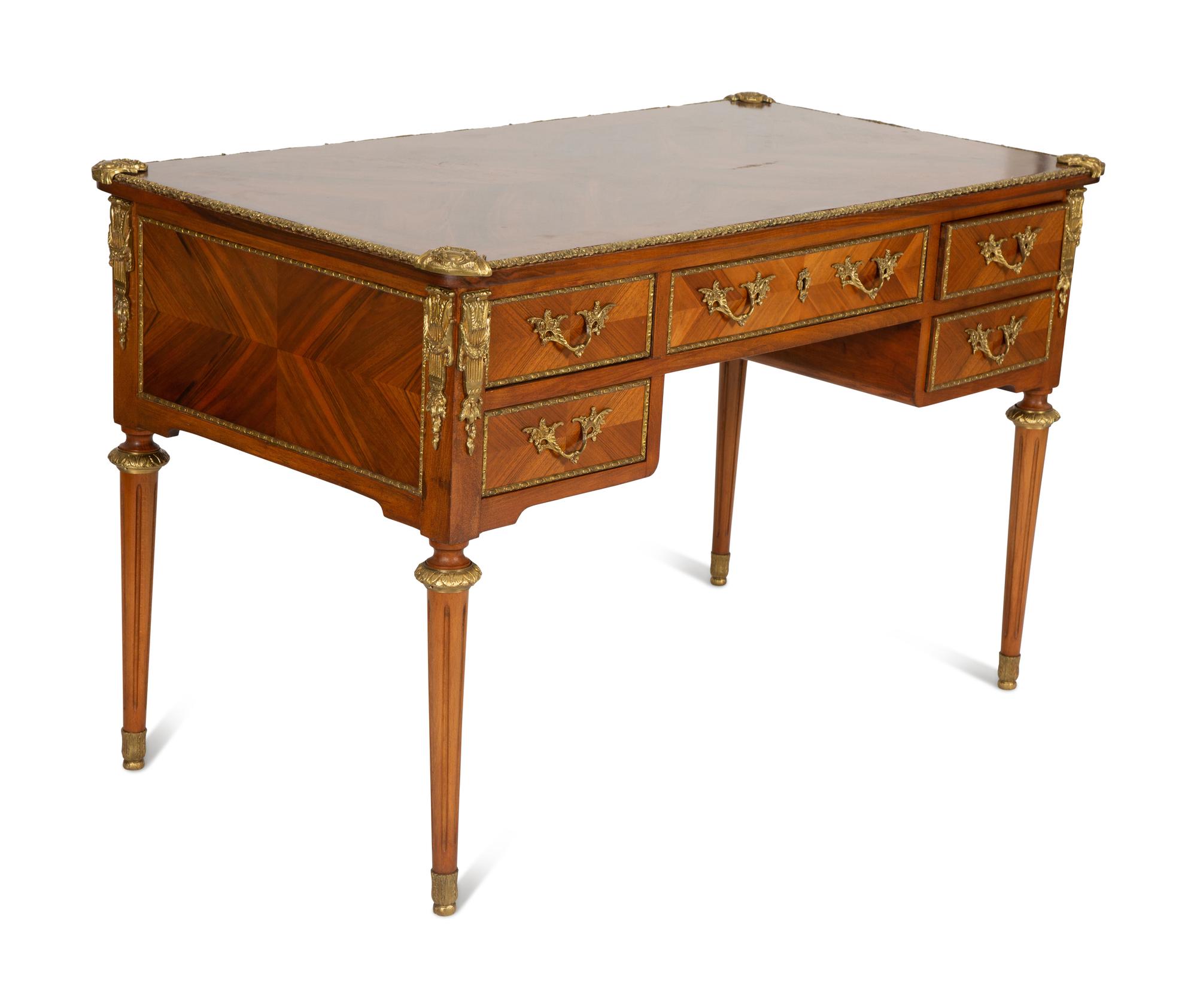 A Louis XVI Style Gilt-Bronze Mounted Mahogany Bureau Plat