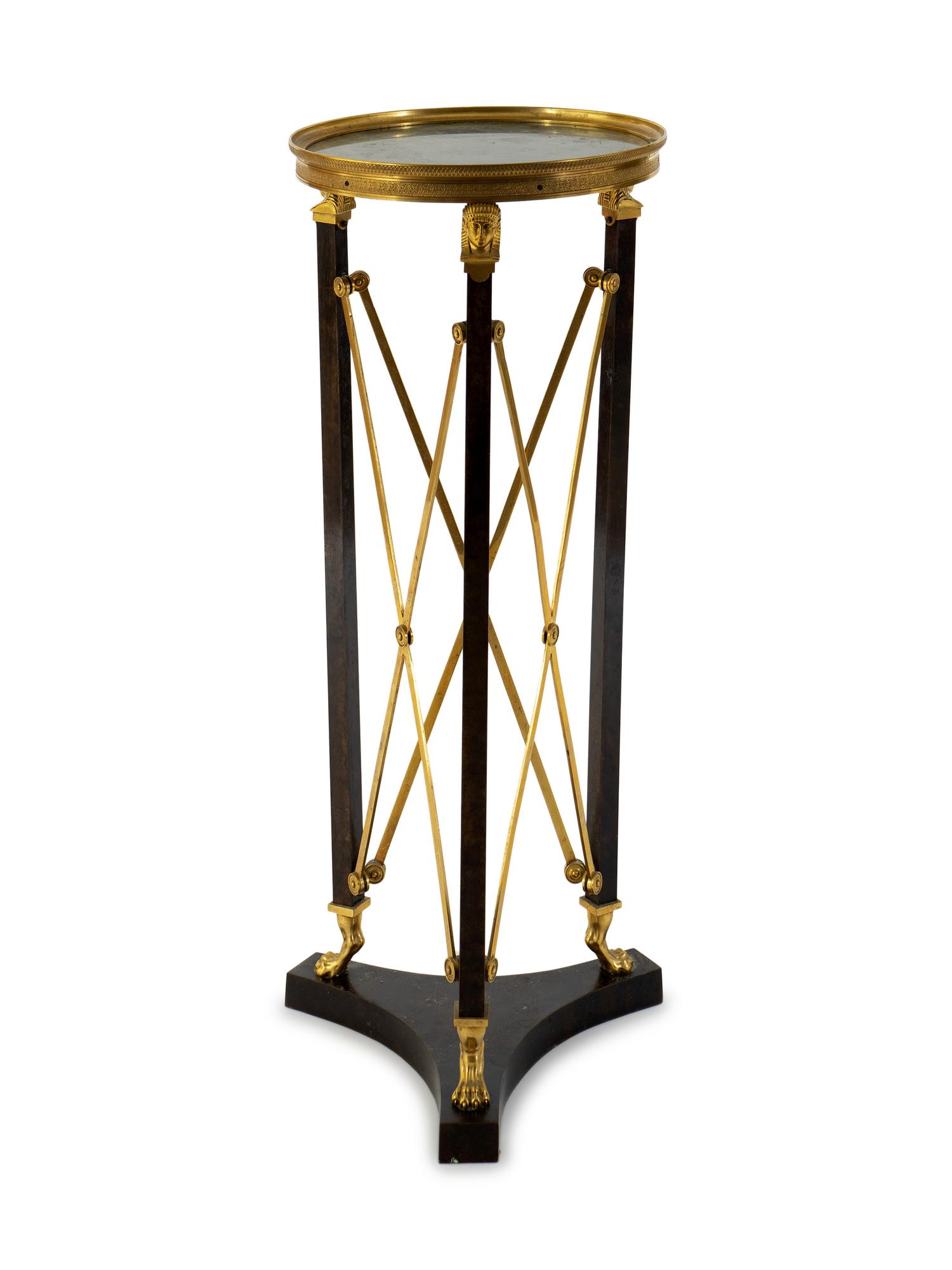 A French Empire Style Gilt Bronze and Ebonized Marble Top Pedestal Table — 20TH CENTURY