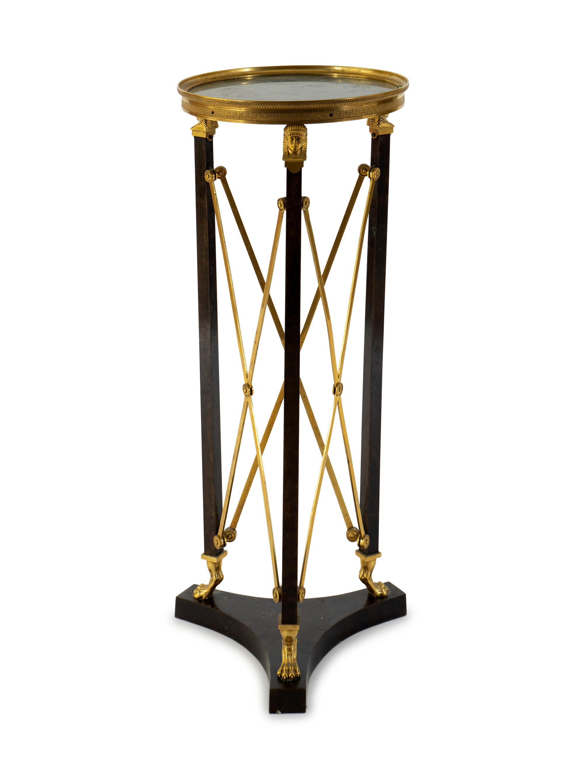 A French Empire Style Gilt Bronze and Ebonized Marble Top Pedestal Table — 20TH CENTURY