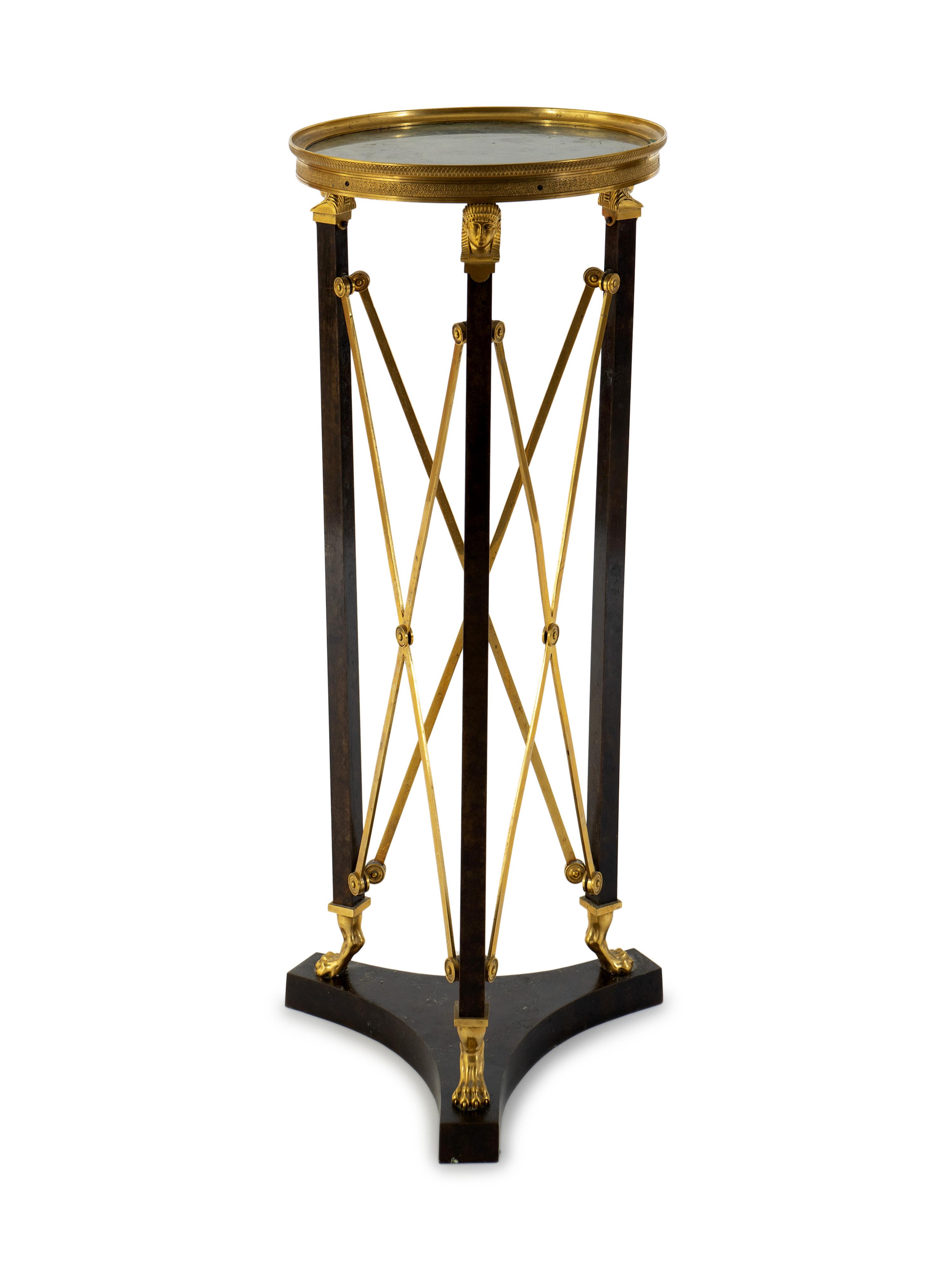 A French Empire Style Gilt Bronze and Ebonized Marble Top Pedestal Table — 20TH CENTURY