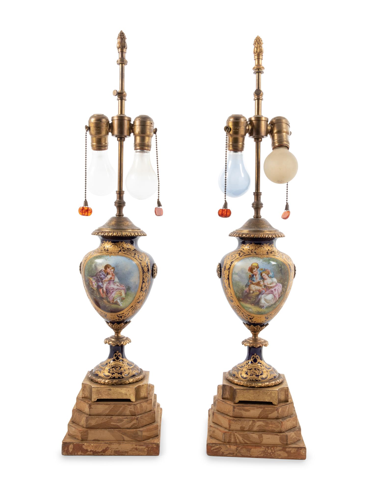 A Pair of Sèvres Style Porcelain Urns Mounted as Lamps