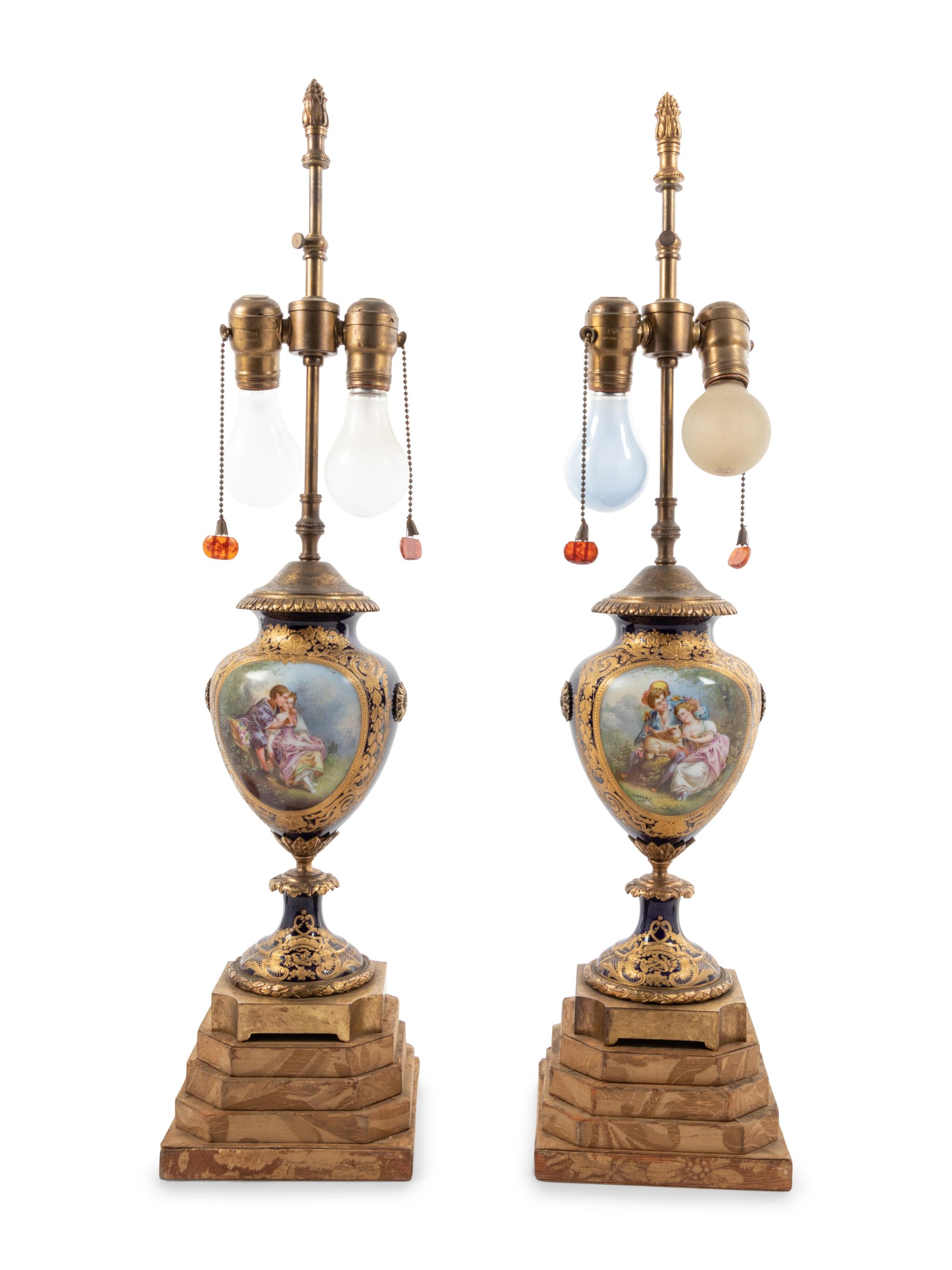 A Pair of Sèvres Style Porcelain Urns Mounted as Lamps