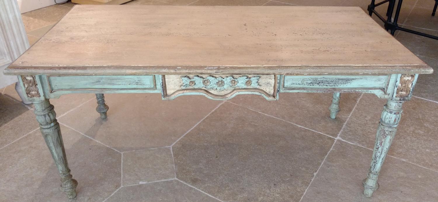 A Painted Table With Floral Carving Height 21 1/4 x length 47 1/2 inches.