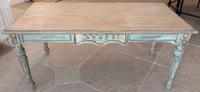 A Painted Table With Floral Carving Height 21 1/4 x length 47 1/2 inches.