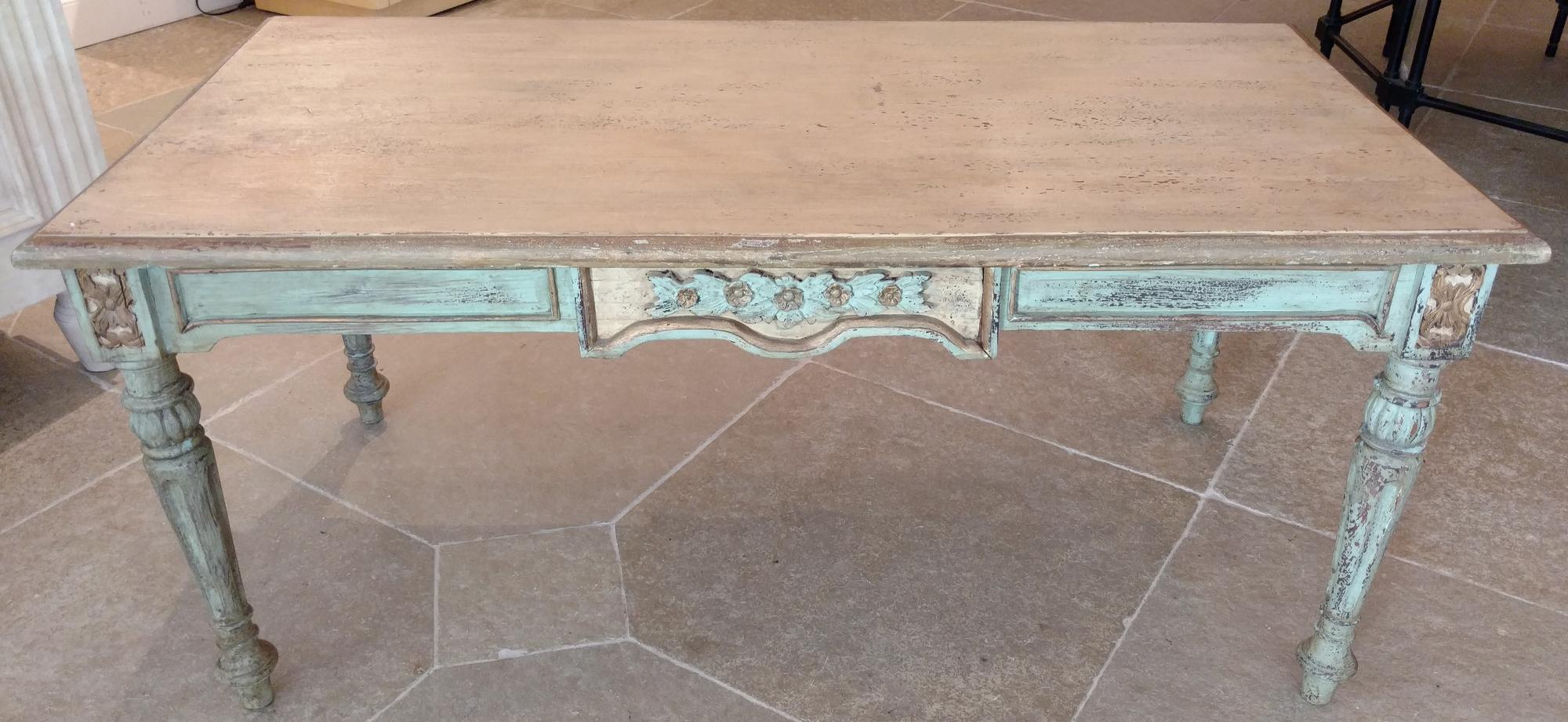 A Painted Table With Floral Carving Height 21 1/4 x length 47 1/2 inches.