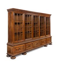 A Renaissance Revival Carved Walnut Vitrine Cabinet