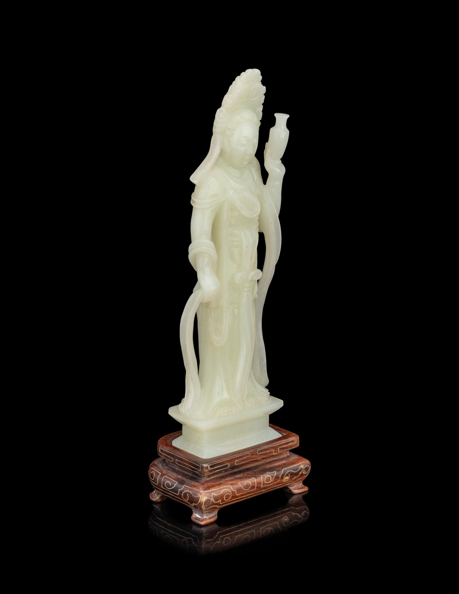 A Pale Celadon Jade Figure of Standing Guanyin