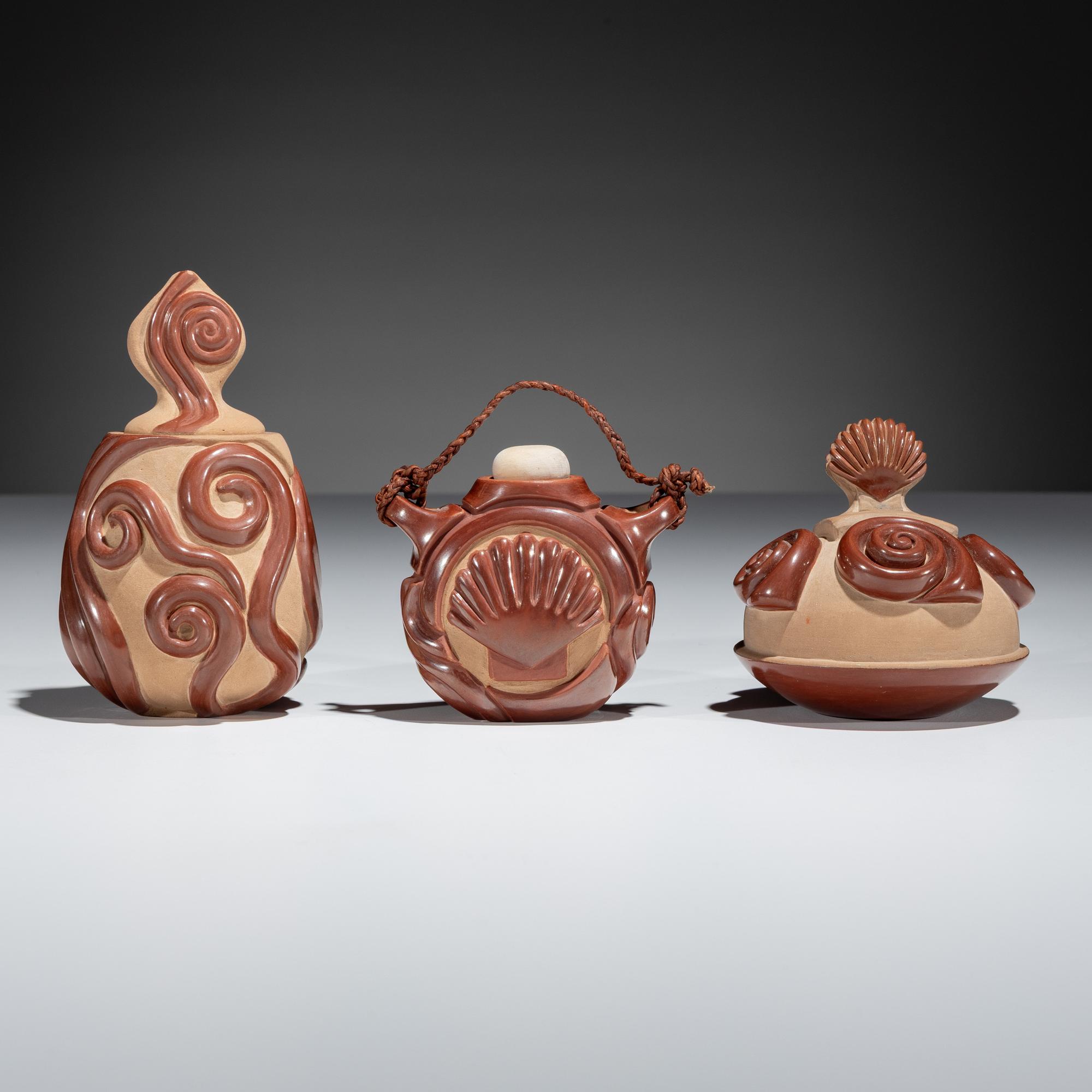 Red and Tan Carved Miniature Pottery