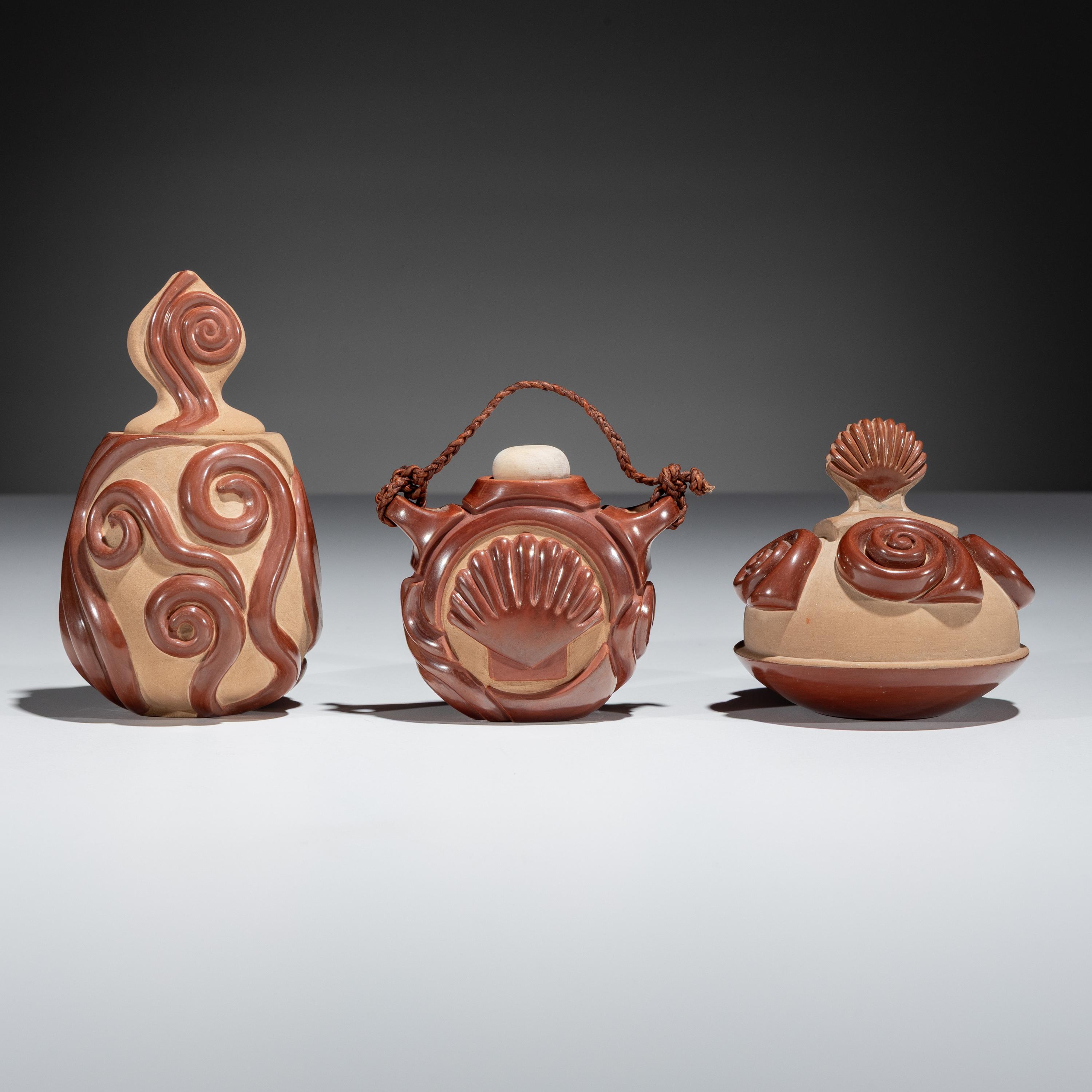 Red and Tan Carved Miniature Pottery