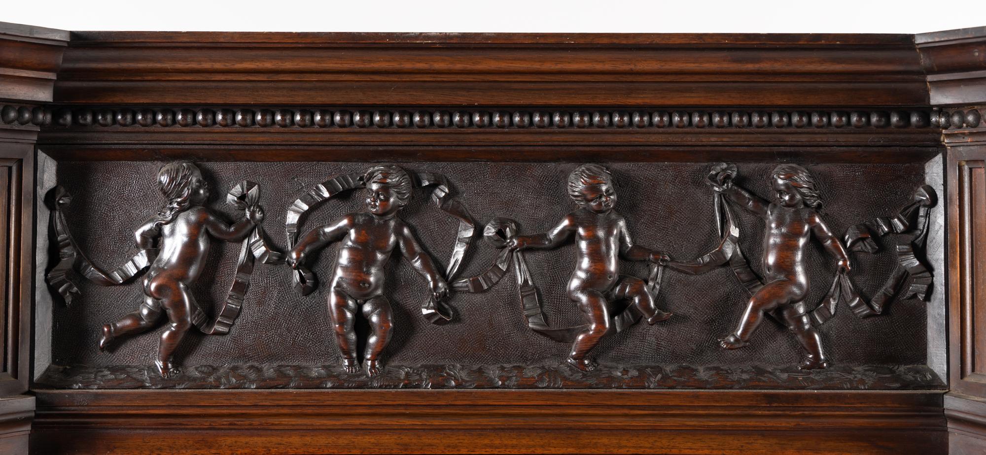 An Italian Renaissance Revival Carved Walnut Cabinet