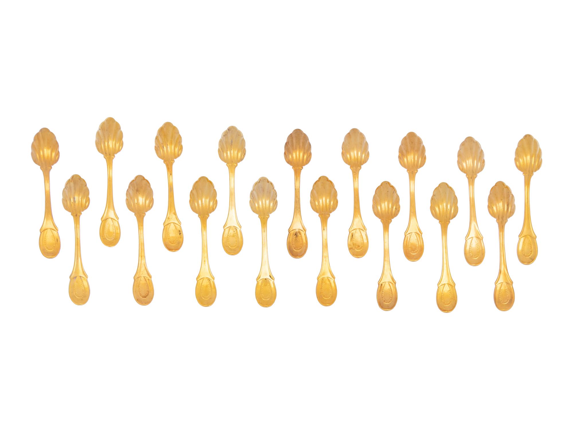 A Set of Twenty-One Gilt Metal Dessert Spoons