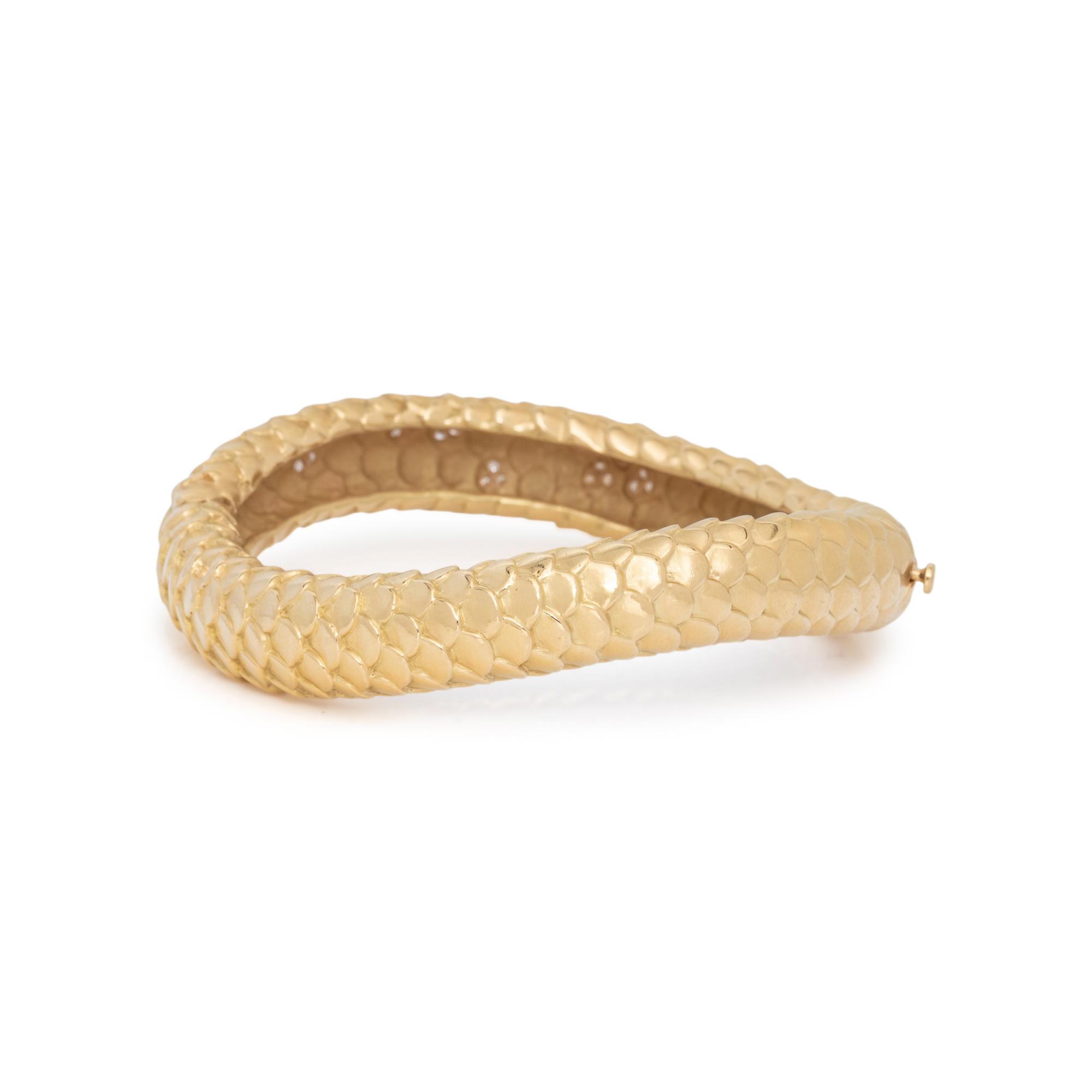 ANGELA CUMMINGS, YELLOW GOLD AND DIAMOND BANGLE BRACELET