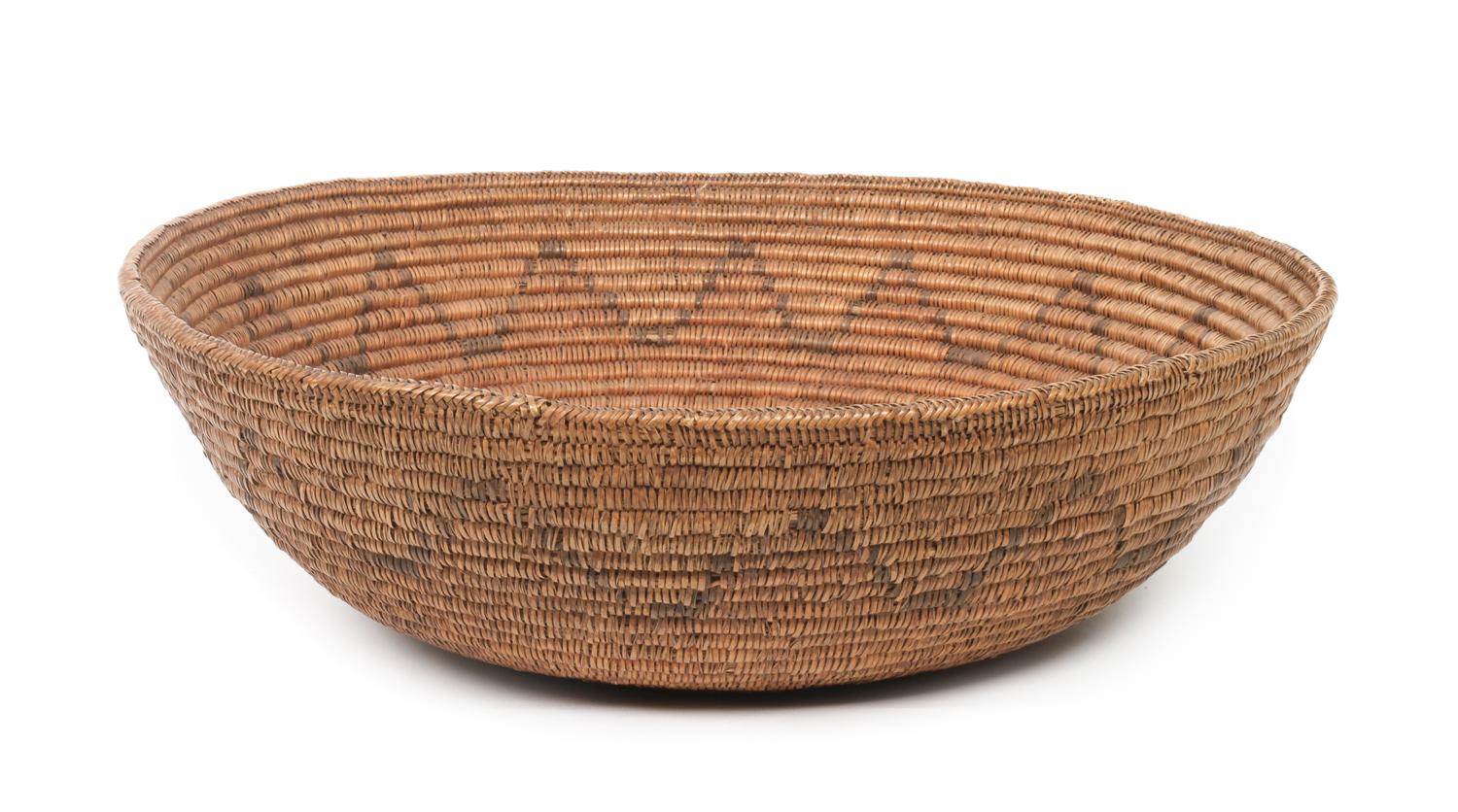 A Navajo Basketry Bowl Height 5 1/2 x diameter 17 3/4 inches.