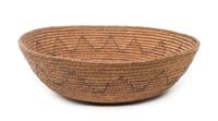 A Navajo Basketry Bowl Height 5 1/2 x diameter 17 3/4 inches.