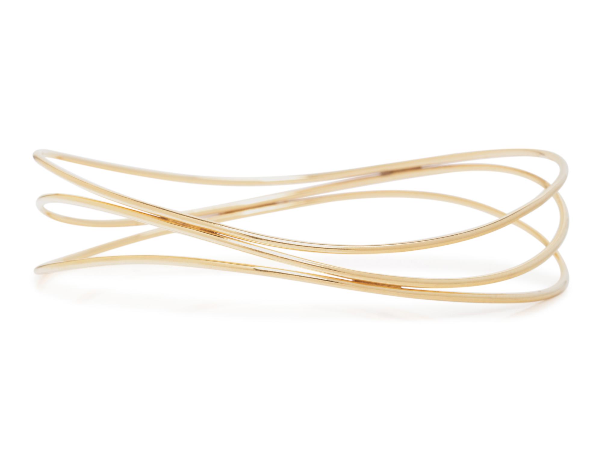 TIFFANY & CO., ELSA PERETTI, YELLOW GOLD 'WAVE' BANGLE BRACELET