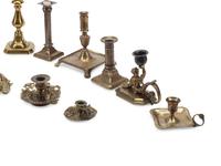A Collection of Brass Candlesticks